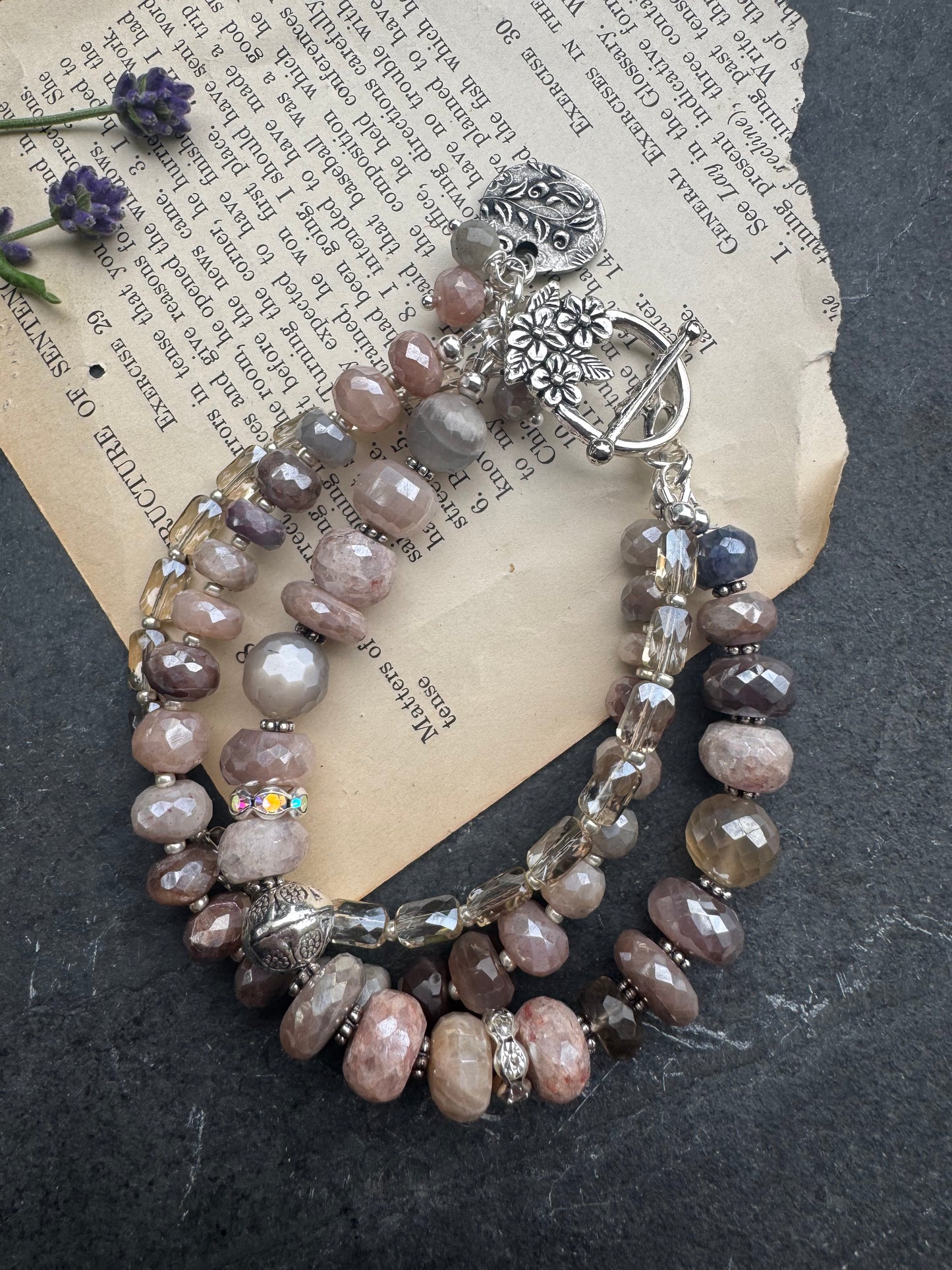 Peach & grey moonstone, crystal, and sterling silver metal.