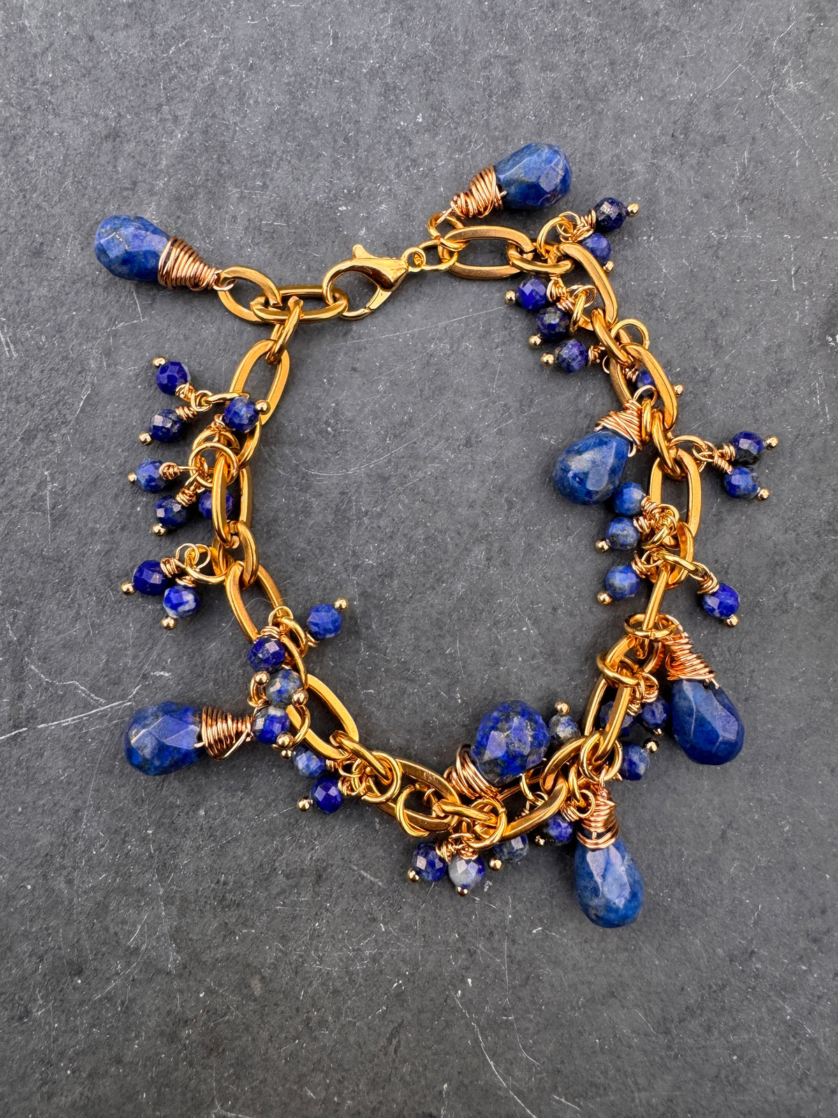 Lapis lazuli and gold chain metal bracelet.