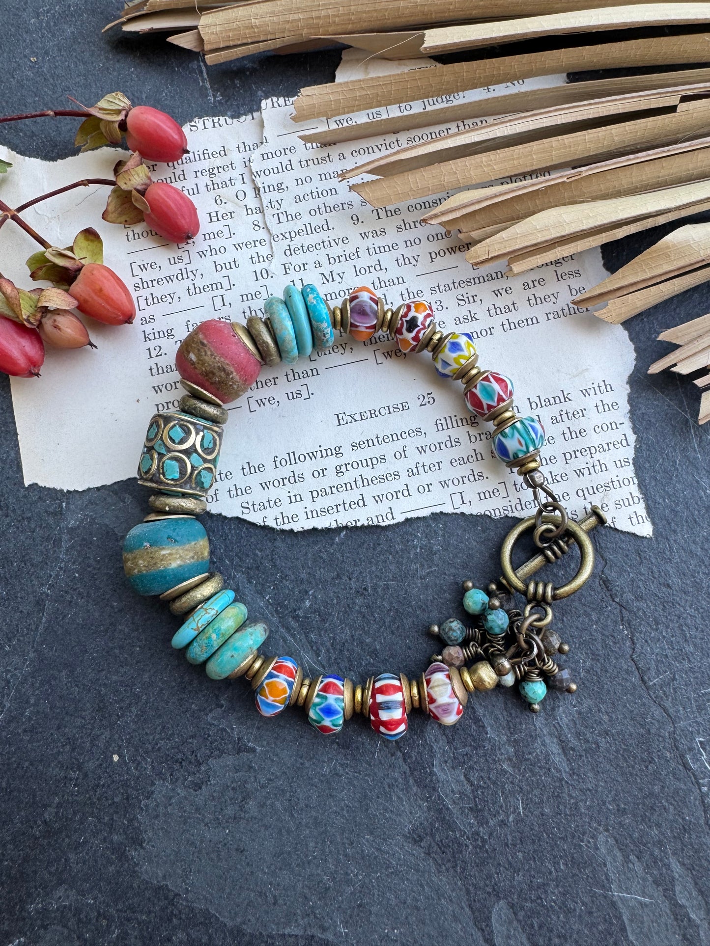 Turquoise stone, nepal glass, African glass, brass metal, bracelet. Czech Button and leather closure.