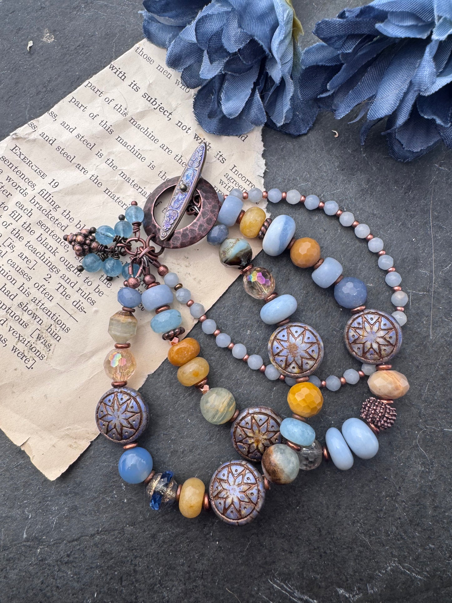 Blue opal, yellow jasper, Czech glass, citrine, agate, blue aventurine, Aquatine Lemurian Blue Calcite and copper metal.