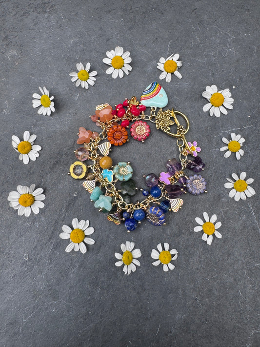 Rainbow bracelet. Mixed gemstone, mixed Czech glass, charms and gold metal bracelet.