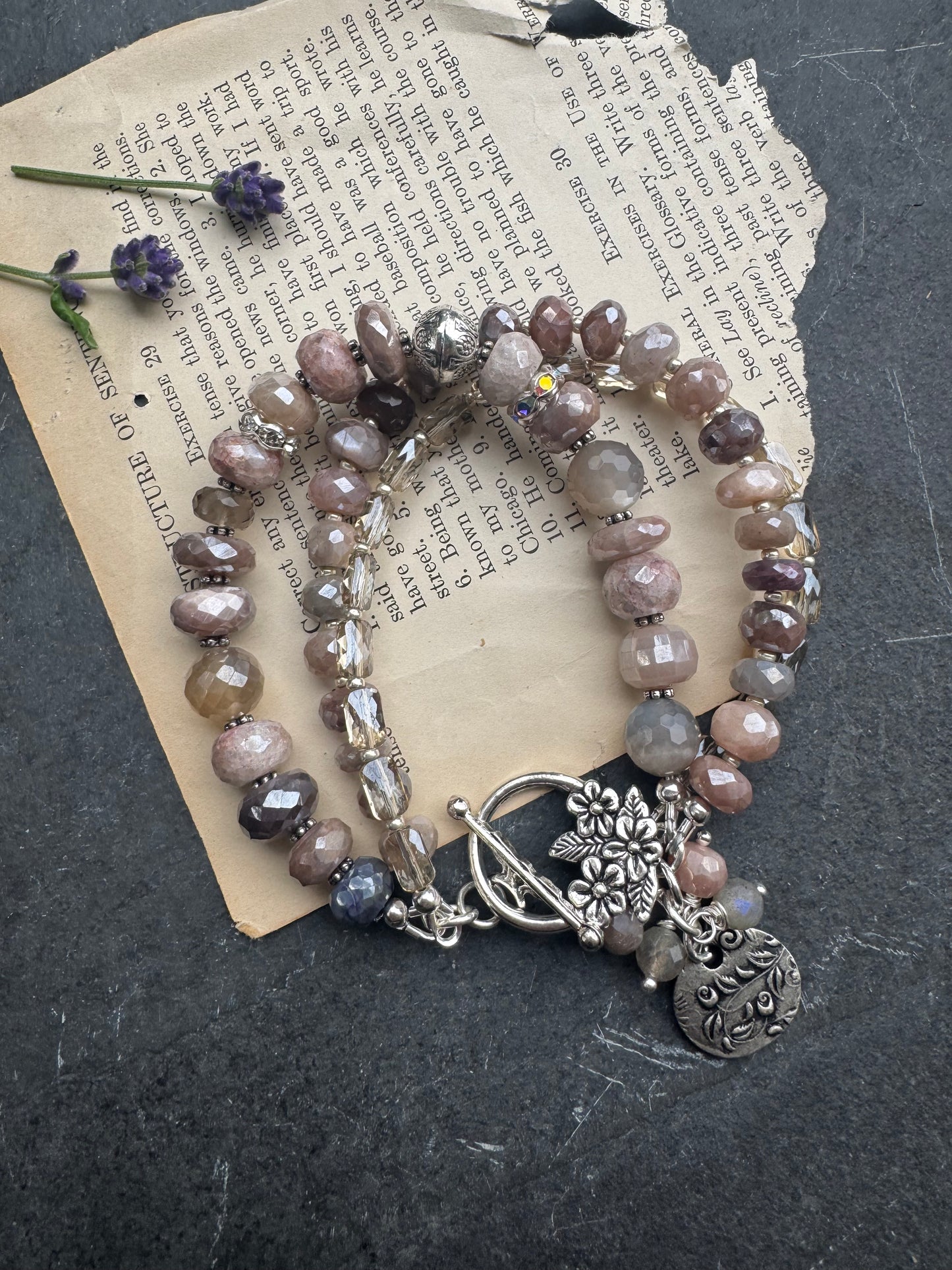Peach & grey moonstone, crystal, and sterling silver metal.
