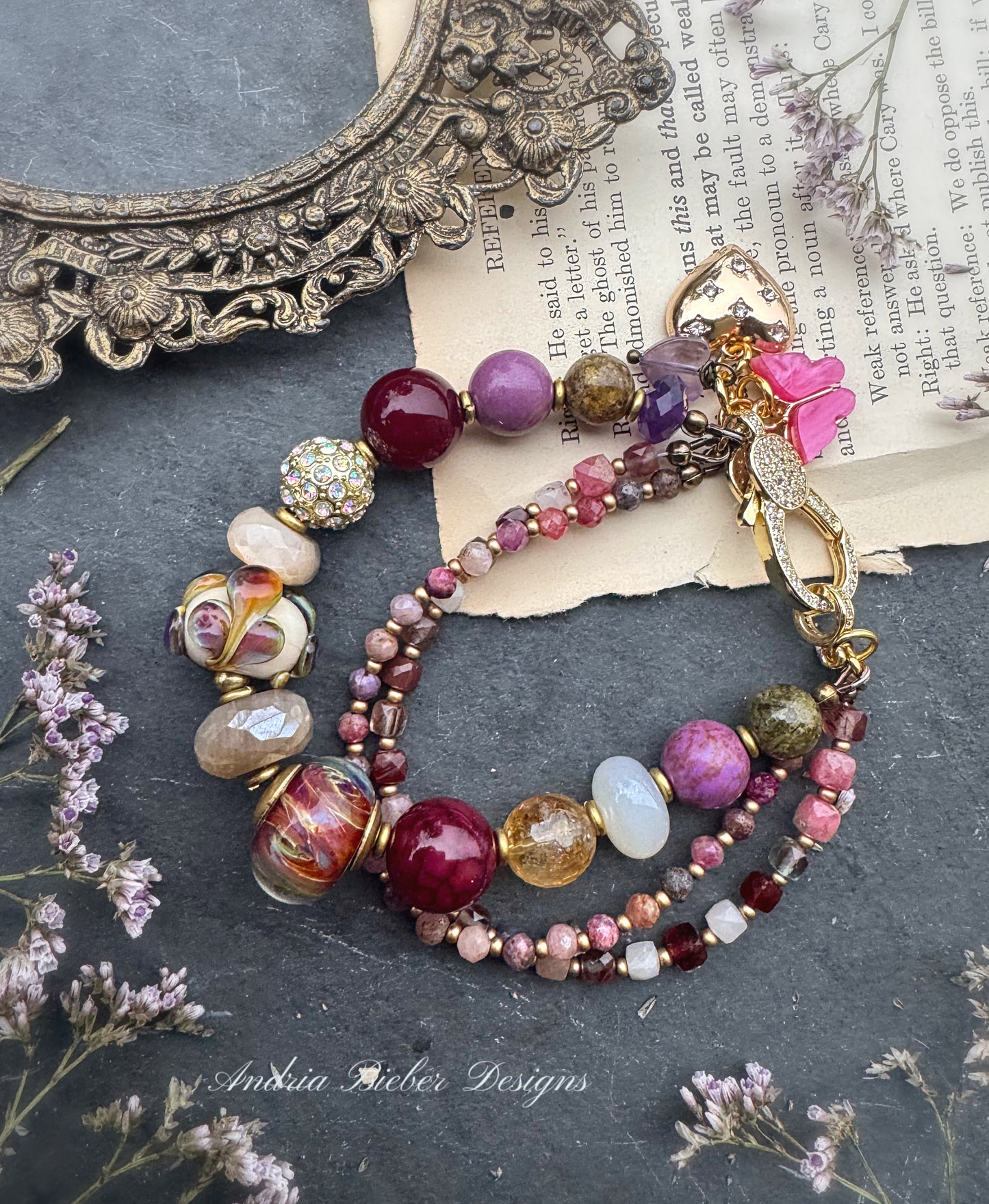 Ruby. Mixed gemstone, lampwork glass, rhinestone clasp.