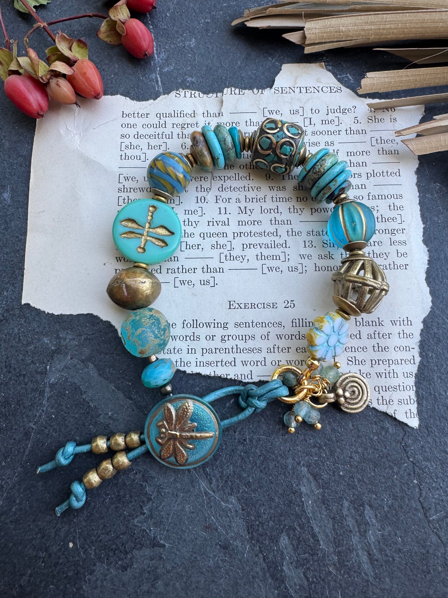 Turquoise stone, Czech glass,African glass, brass metal, bracelet. Czech Button and leather closure.