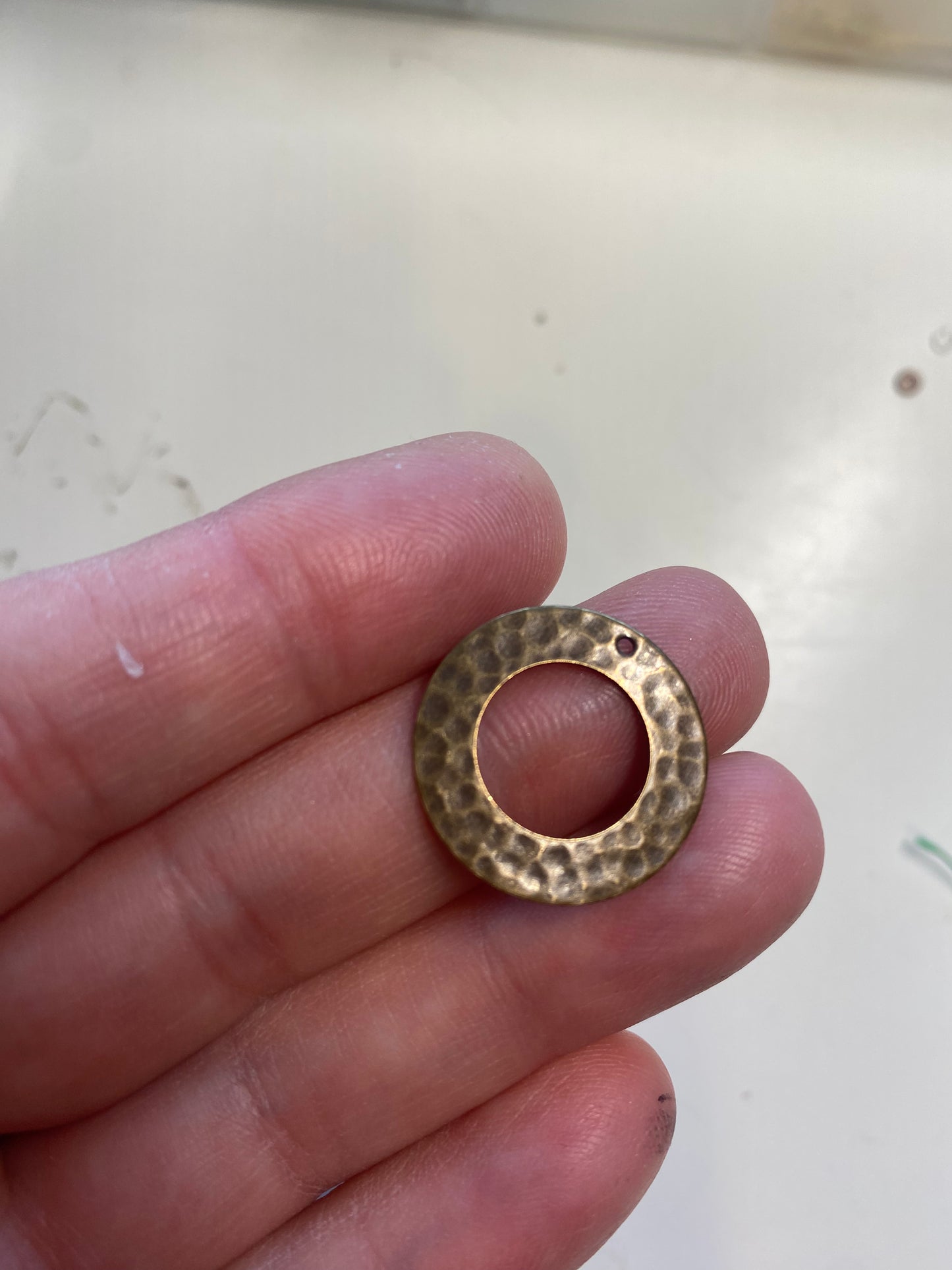 Hammered hoop and filigree toggle bar clasp. Chocolate brown bronze metal.