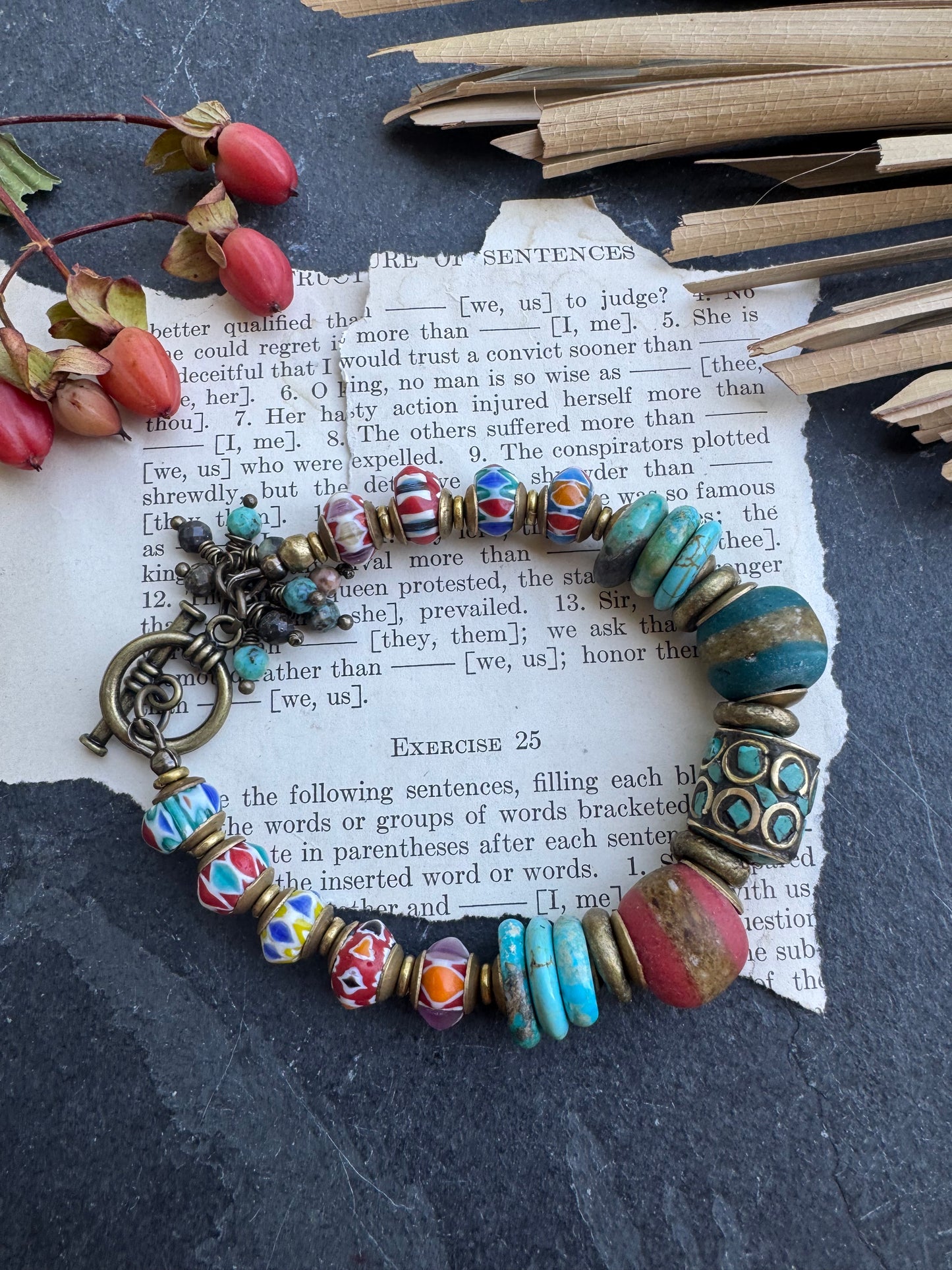 Turquoise stone, nepal glass, African glass, brass metal, bracelet. Czech Button and leather closure.