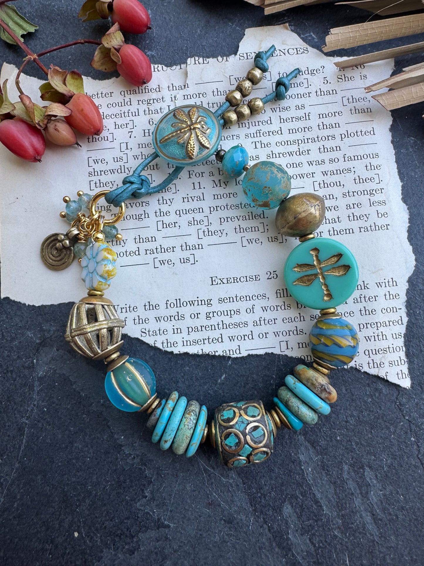 Turquoise stone, Czech glass,African glass, brass metal, bracelet. Czech Button and leather closure.