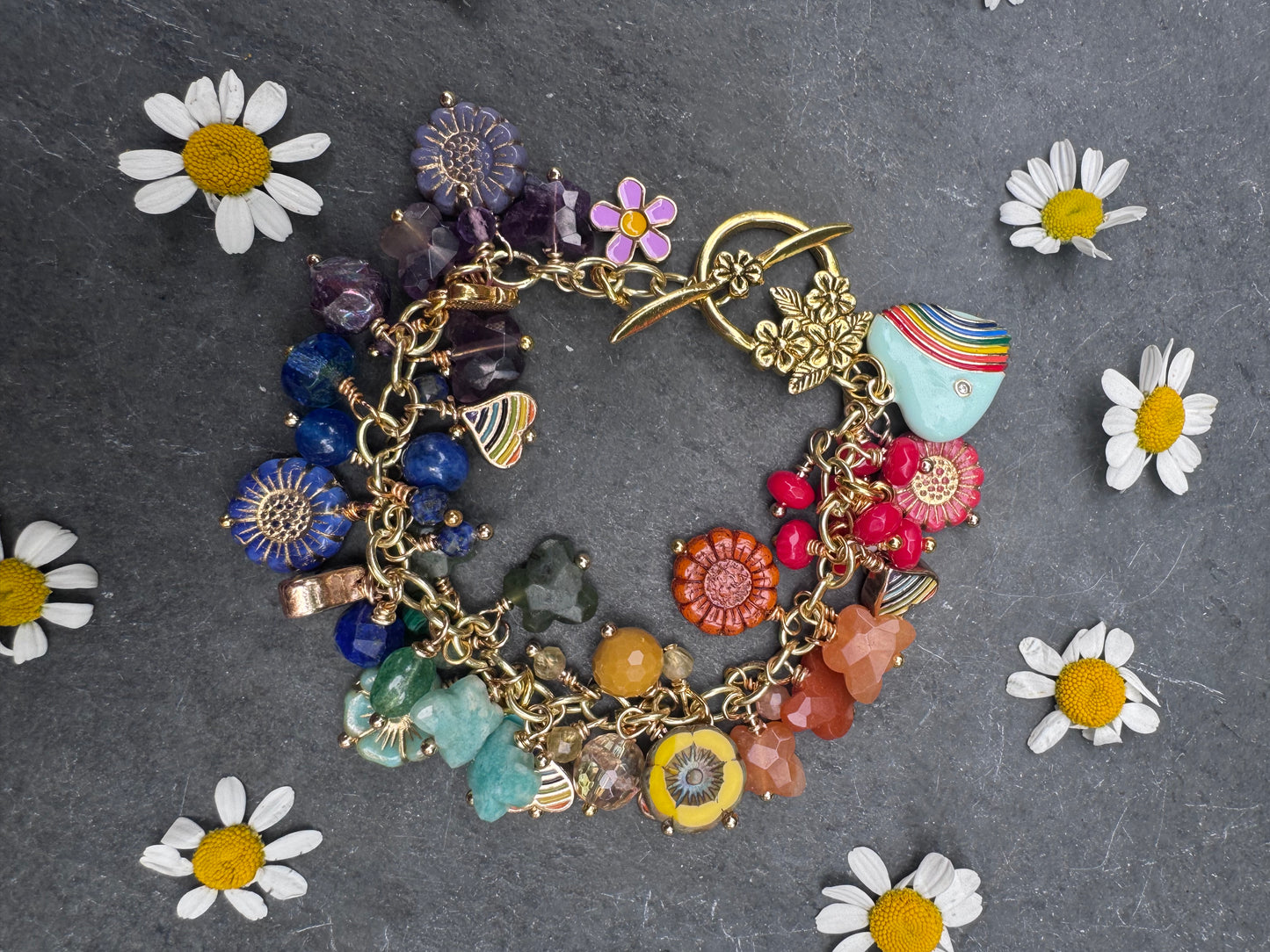 Rainbow bracelet. Mixed gemstone, mixed Czech glass, charms and gold metal bracelet.