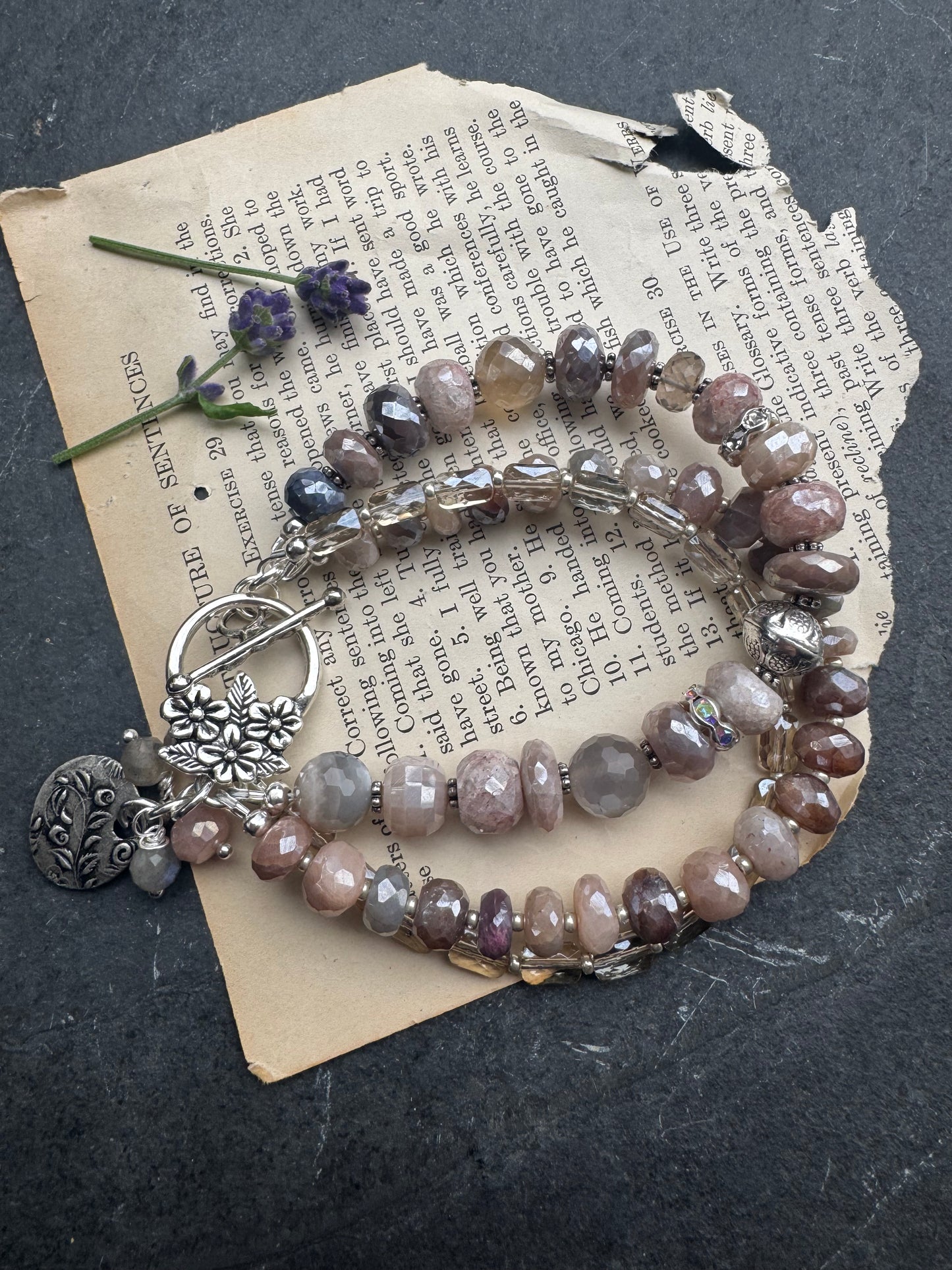 Peach & grey moonstone, crystal, and sterling silver metal.