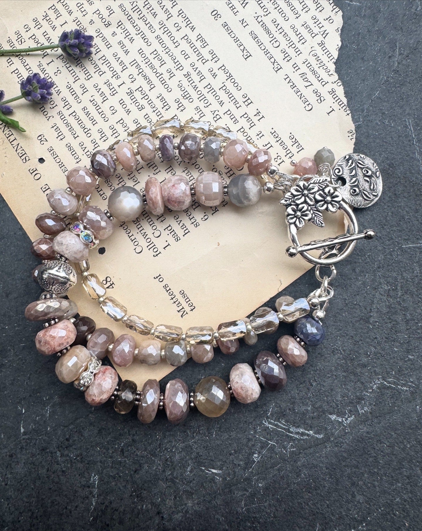 Peach & grey moonstone, crystal, and sterling silver metal.