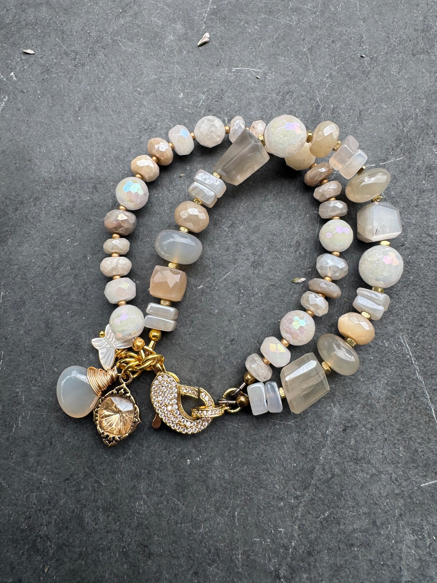 Moonstone, rhinestone clasp, two multi strand, gold metal, bracelet.