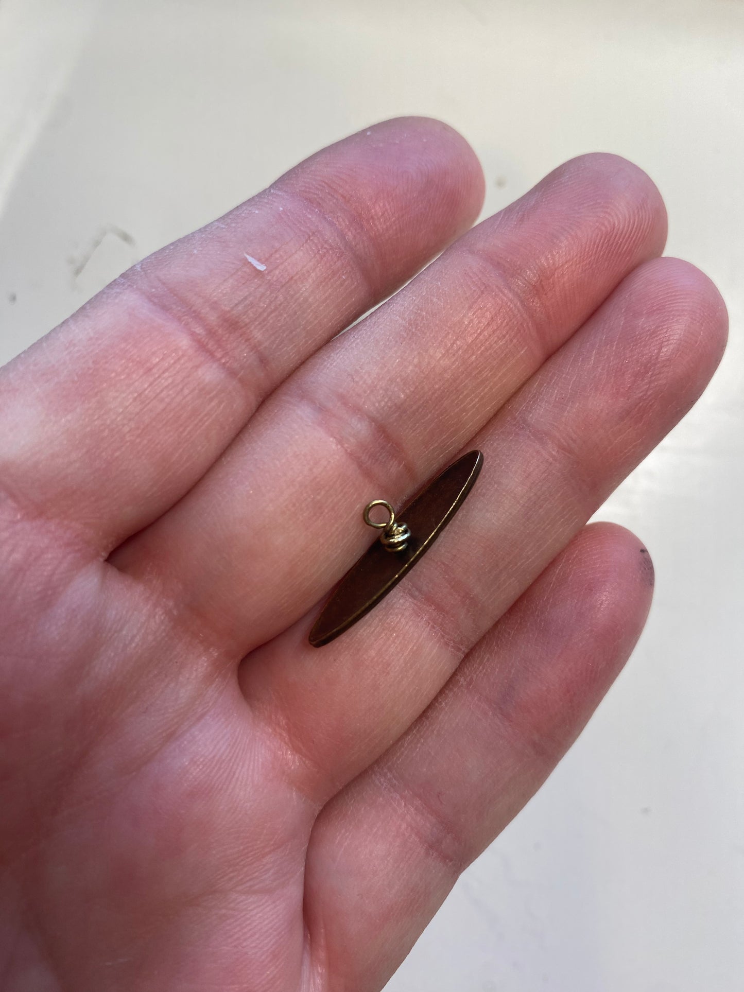 Hammered hoop and filigree toggle bar clasp. Chocolate brown bronze metal.