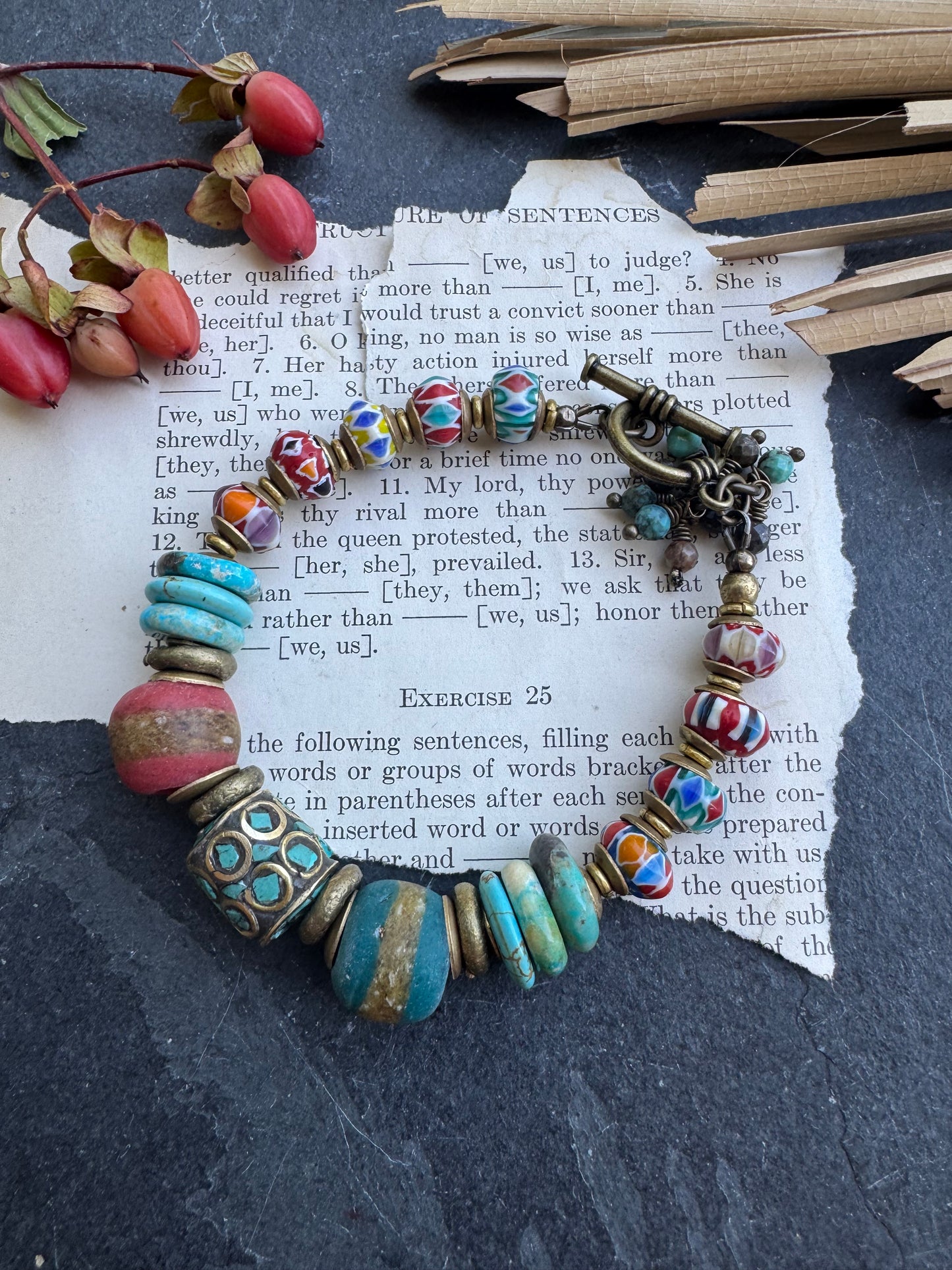Turquoise stone, nepal glass, African glass, brass metal, bracelet. Czech Button and leather closure.