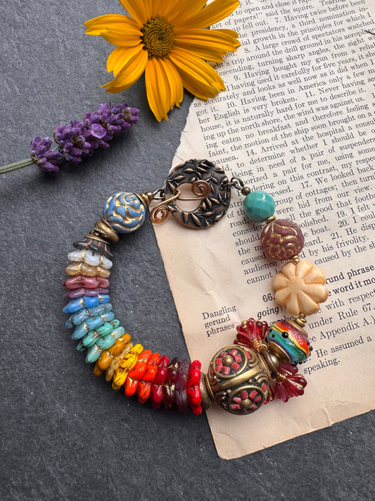 Rainbow flowers. Nepal coral flower bead, Mixed Czech glass flowers, lampwork glass, leaf bronze toggle clasp.