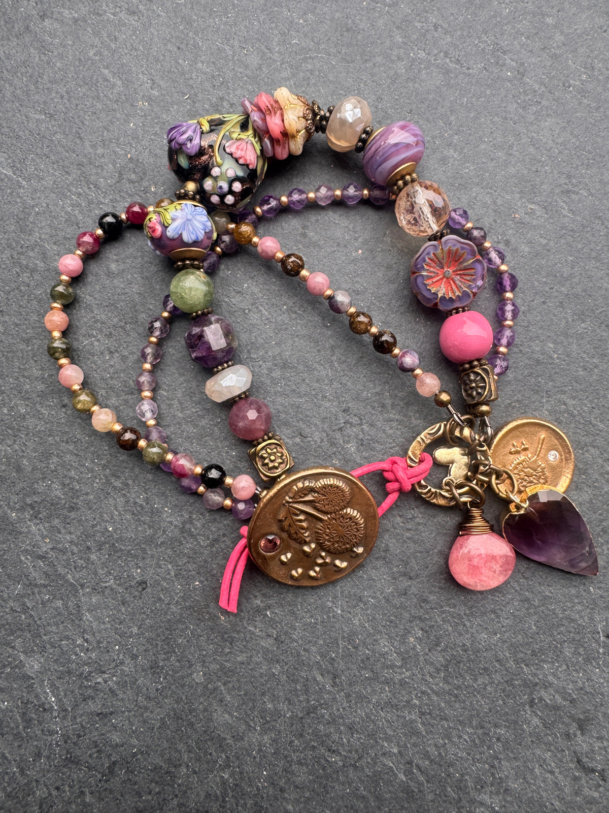 handmade lampwork glass, amethyst, tourmaline, moonstone, Madagascar rose quartz, pink tourmaline and handmade dandy lion button clasp.