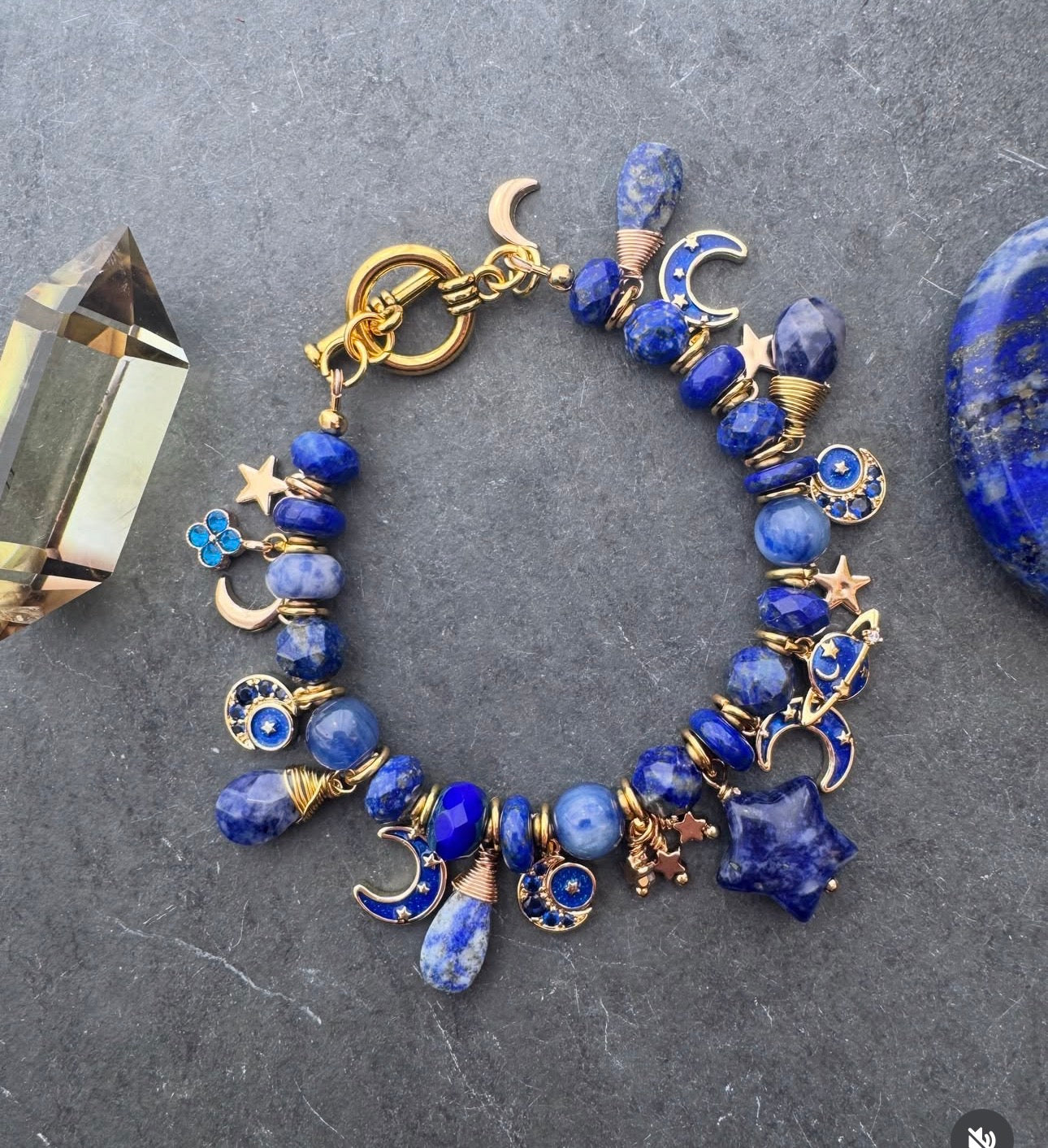Space charm bracelet. Lapis lazuli, sodalite, charms and gold metal bracelet.