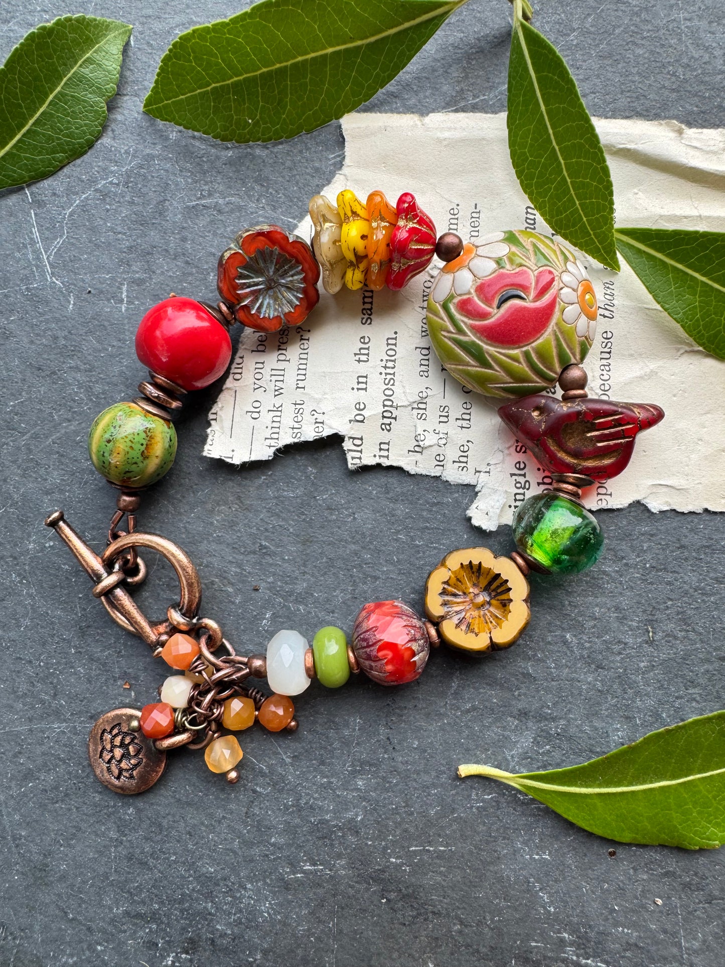 Bird. czech glass, lampwork glass, ceramic, copper metal.