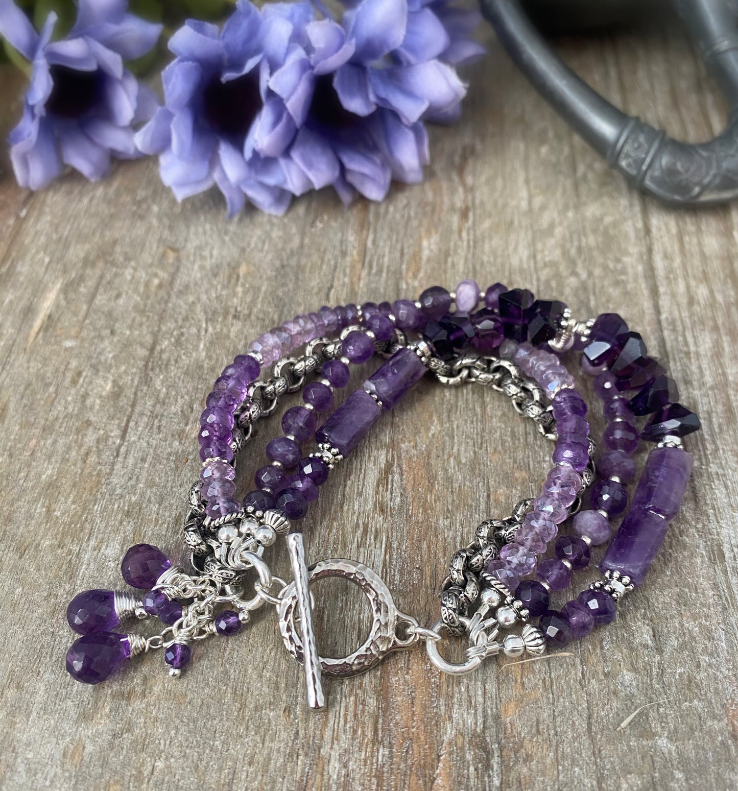 MAmethyst gemstone and silver metal, multi strand bracelet.