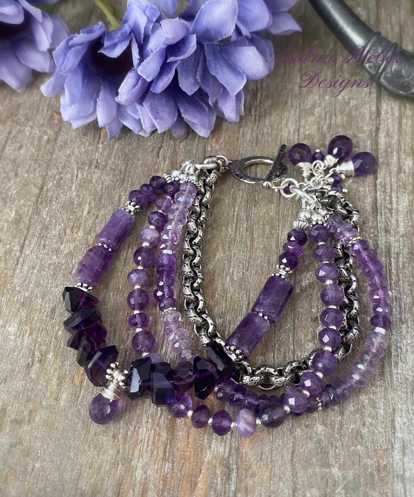 MAmethyst gemstone and silver metal, multi strand bracelet.