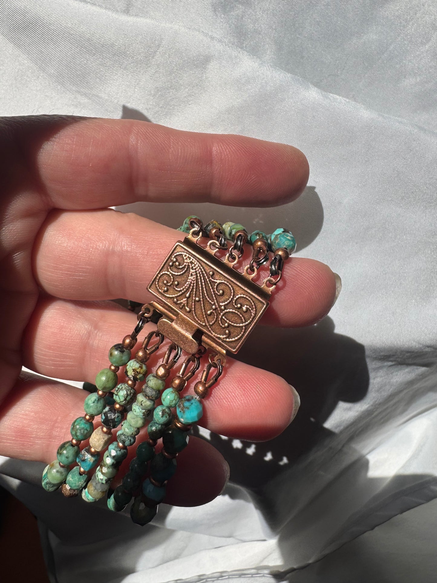 Turquoise and copper metal, multi strand, bracelet. MTO.