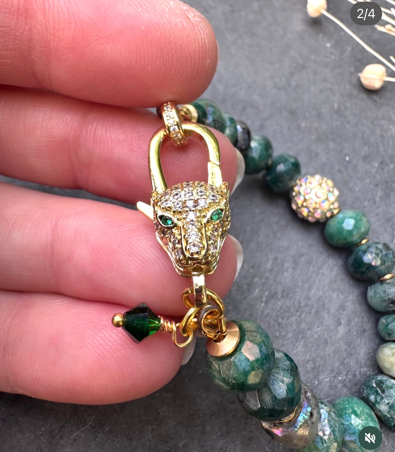Emerald faceted stone-AB coating, jaguar gold rhinestone clasp.