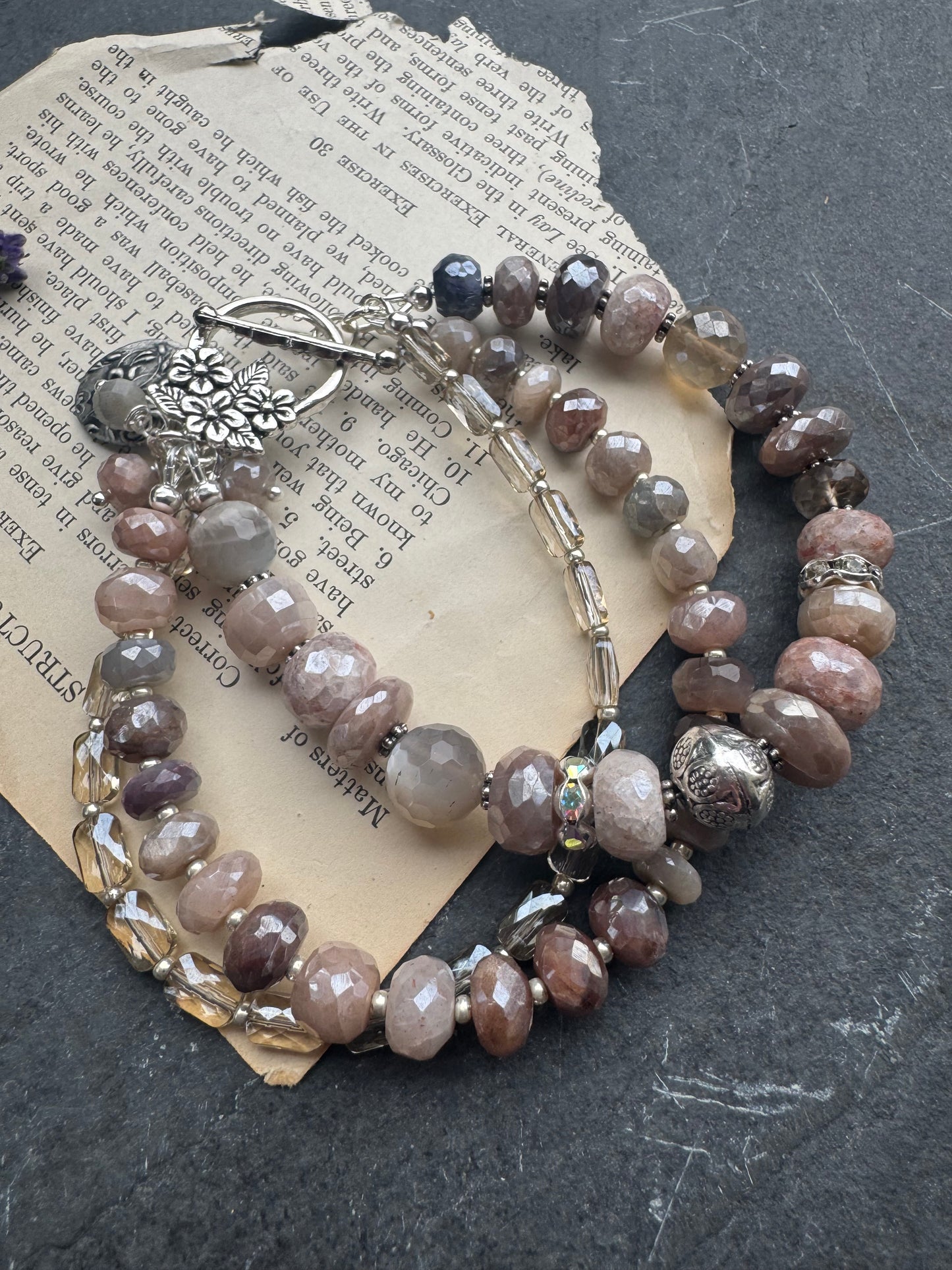 Peach & grey moonstone, crystal, and sterling silver metal.