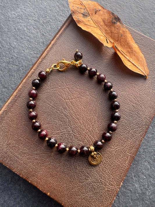 Garnet round stone, brass metal charm, bracelet