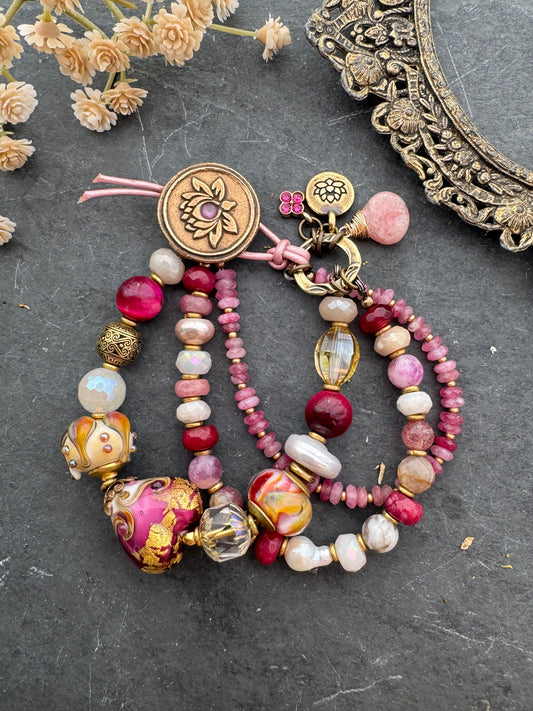 Ruby. handmade lampwork glass, moonstone, strawberry quartz, ruby, pink tourmaline, topaz, pearls, lotus flower button, pink leather, bracelet