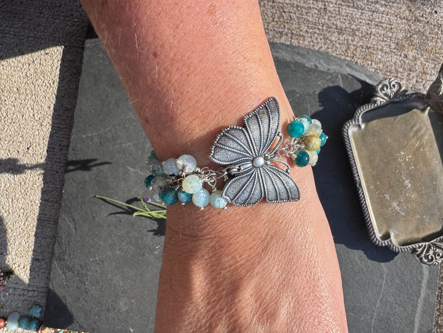 Blue crackled agate stone, butterfly and silver metal bracelet.