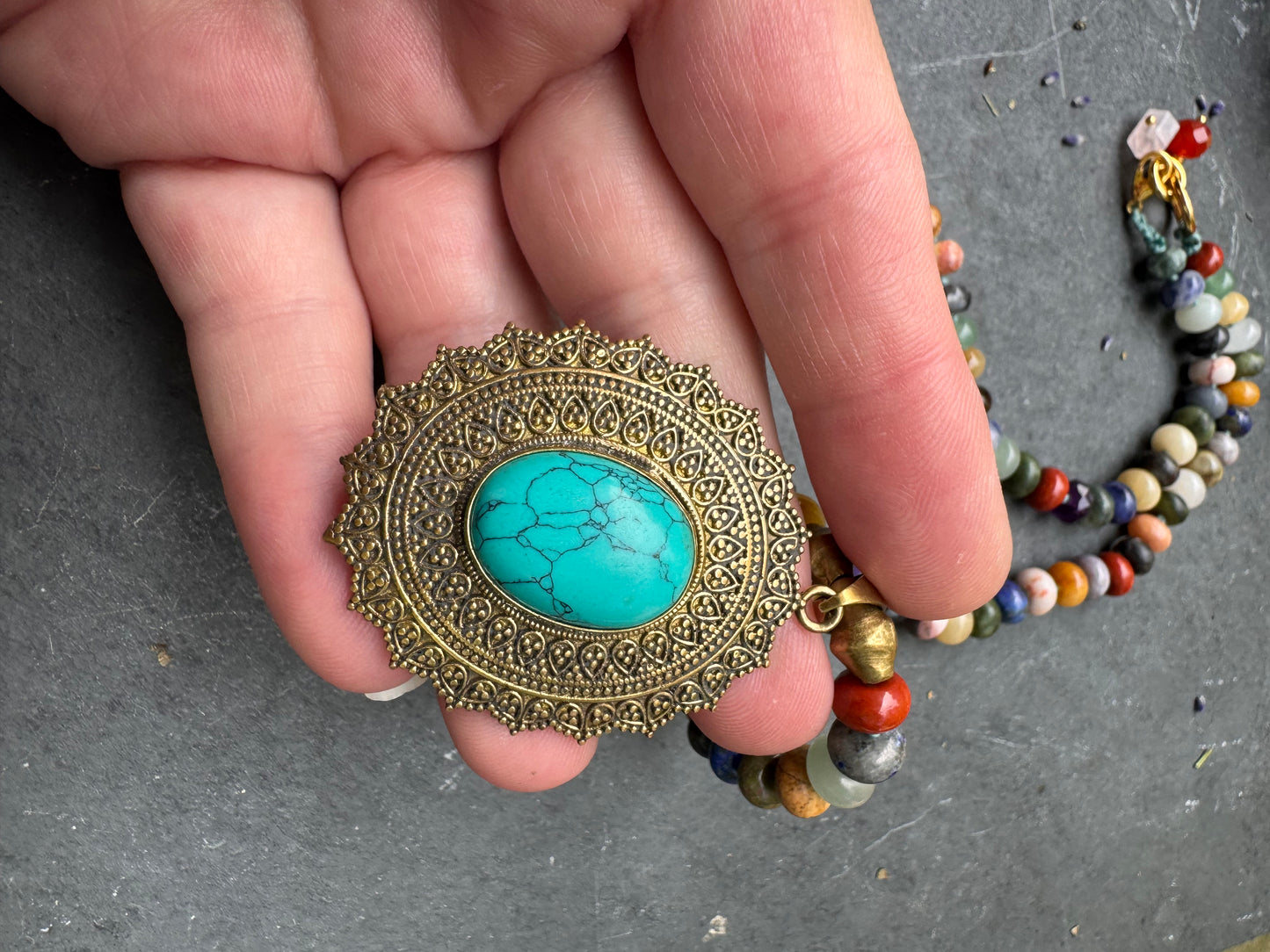 Mixed stone, knotted, brass metal and turquoise stone pendant, necklace