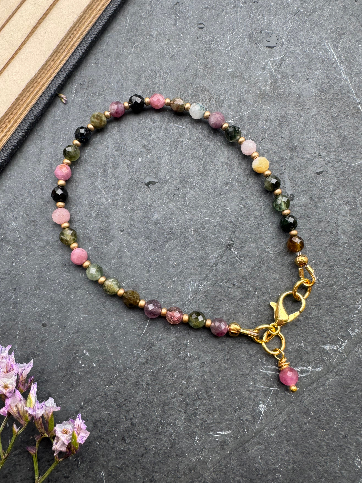 Watermelon tourmaline faceted round stone, gold metal, bracelet