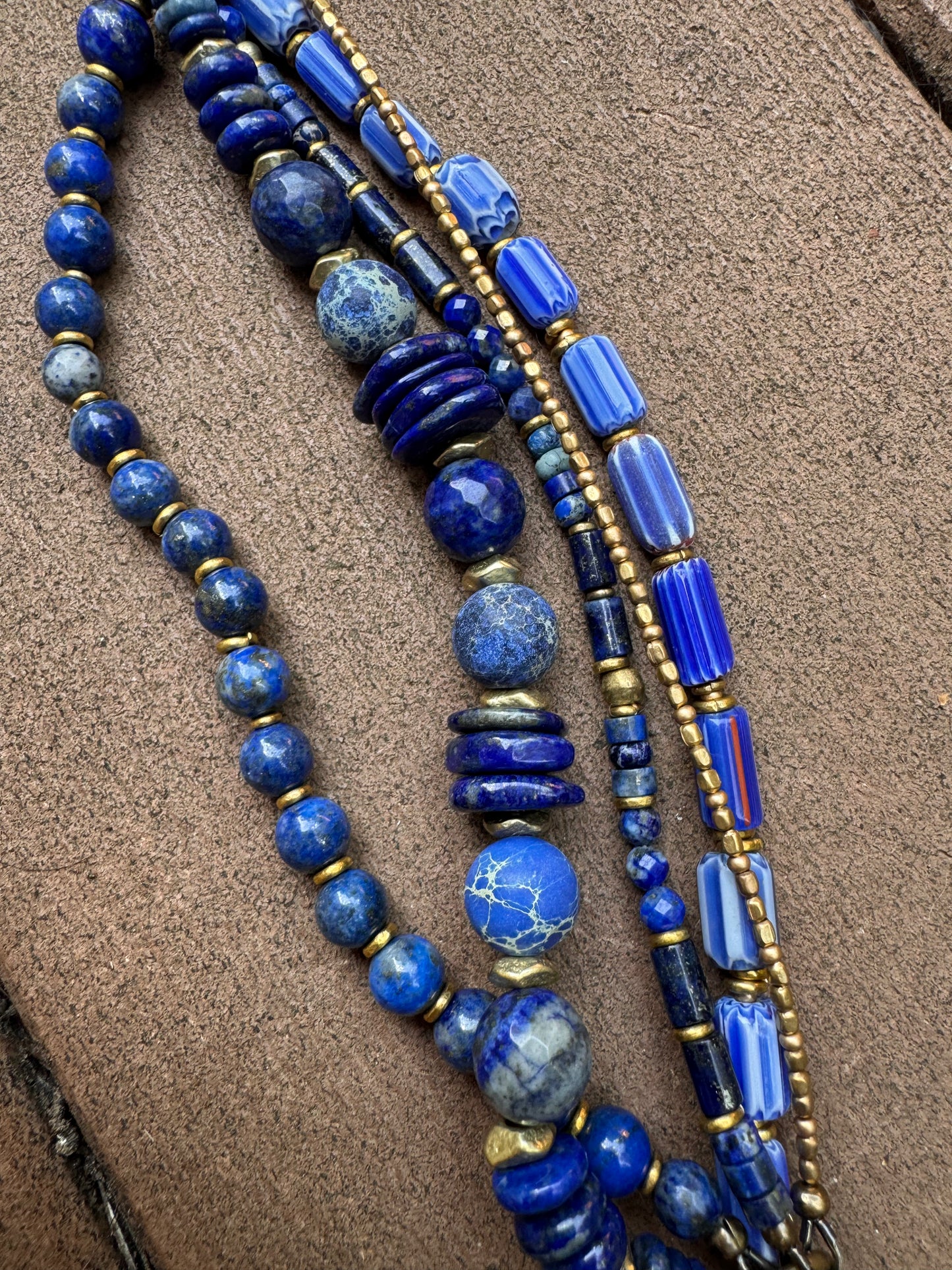 Lapis lazuli, African glass, agate, brass metal bracelet.