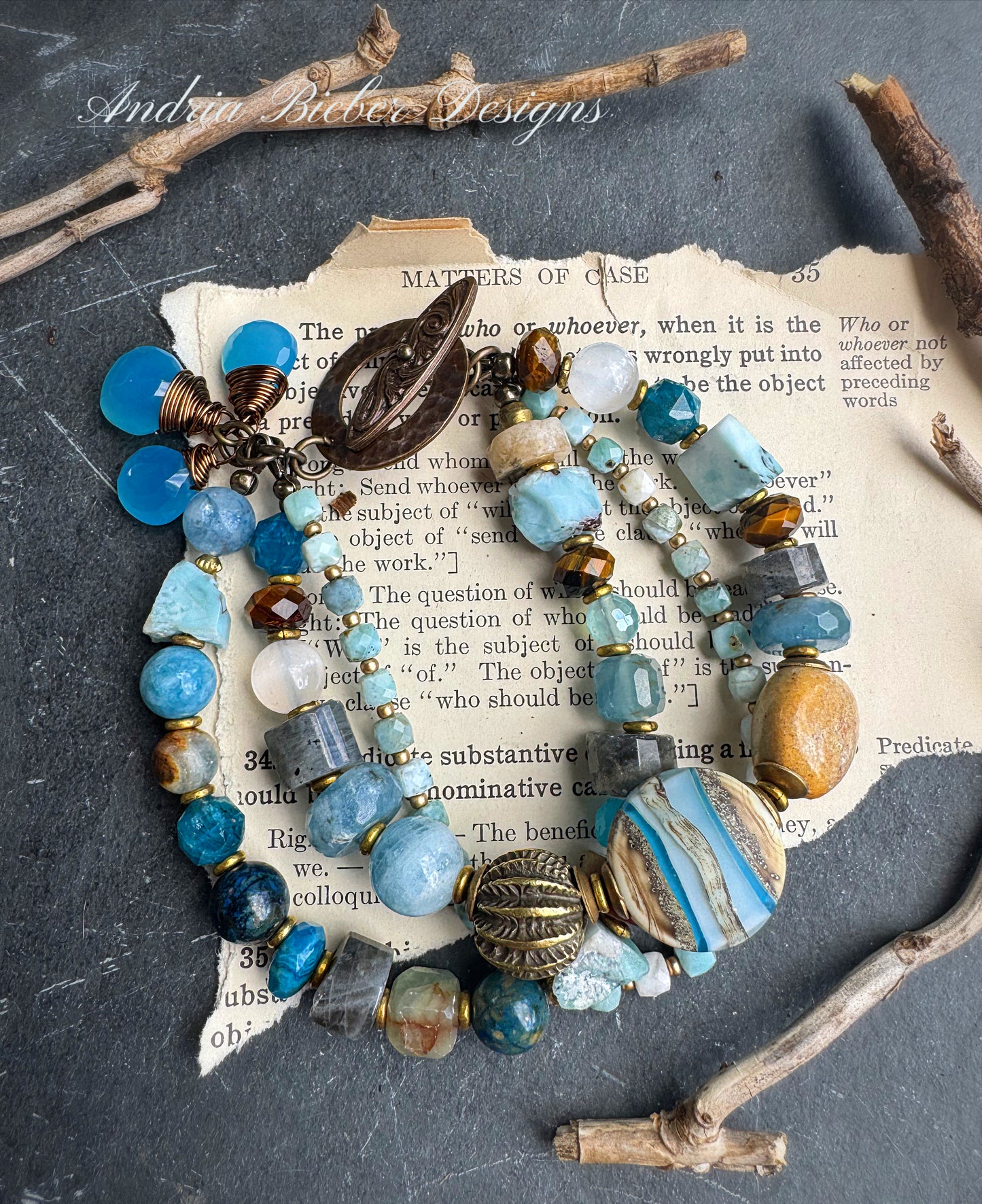 Larimar gemstone, aquamarine, moonstone, blue chalcedony, labradorite, apatite, tiger eye, lampwork , ceramic, Amazonite stone, brass metal.