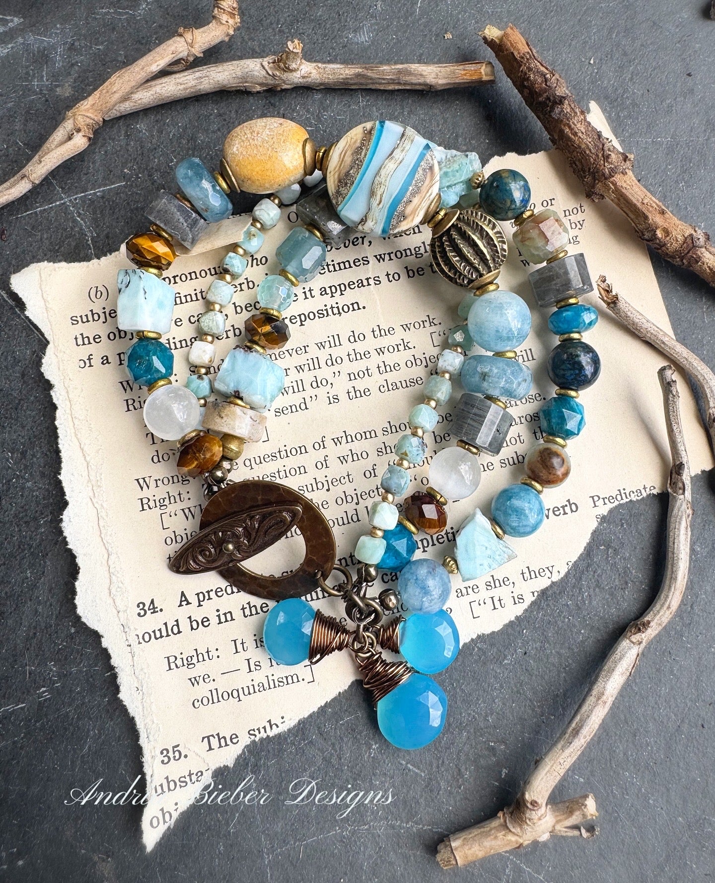Larimar gemstone, aquamarine, moonstone, blue chalcedony, labradorite, apatite, tiger eye, lampwork , ceramic, Amazonite stone, brass metal.