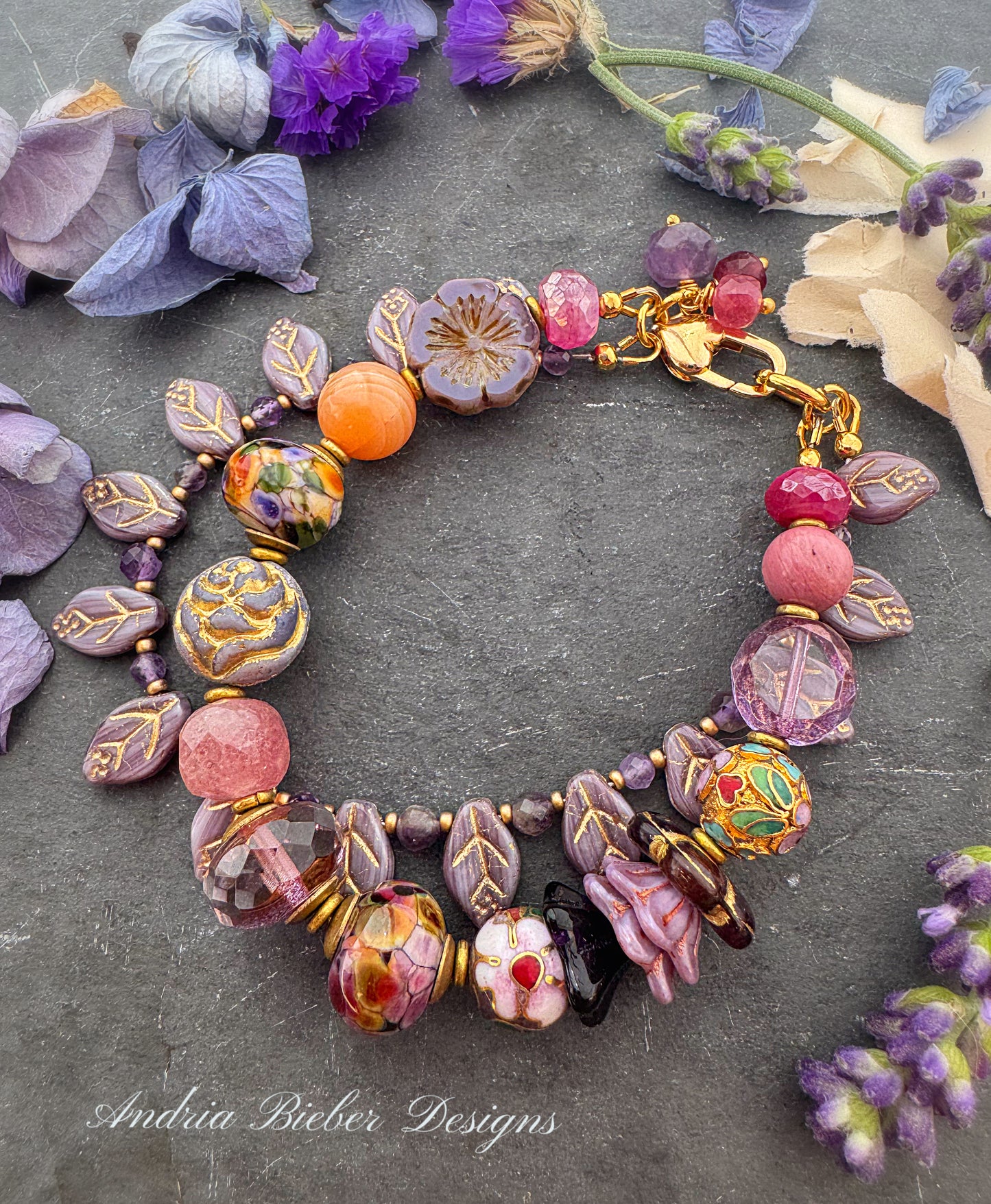 lampwork glass, mixed pink stone, Cloisonné beads, Czech glass, pink moonstone and amethyst. African brass, Czech glass leaves.