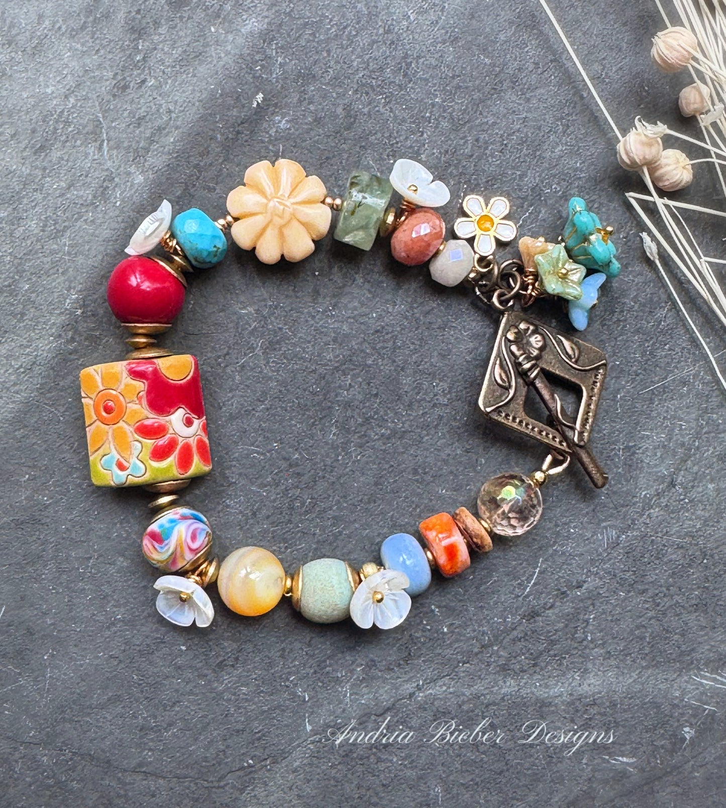 Flower garden. blue opal, lampwork glass, shell, citrine, ceramic, spiny oyster, prehnite, peach moonstone, bone and Czech glass bracelet.