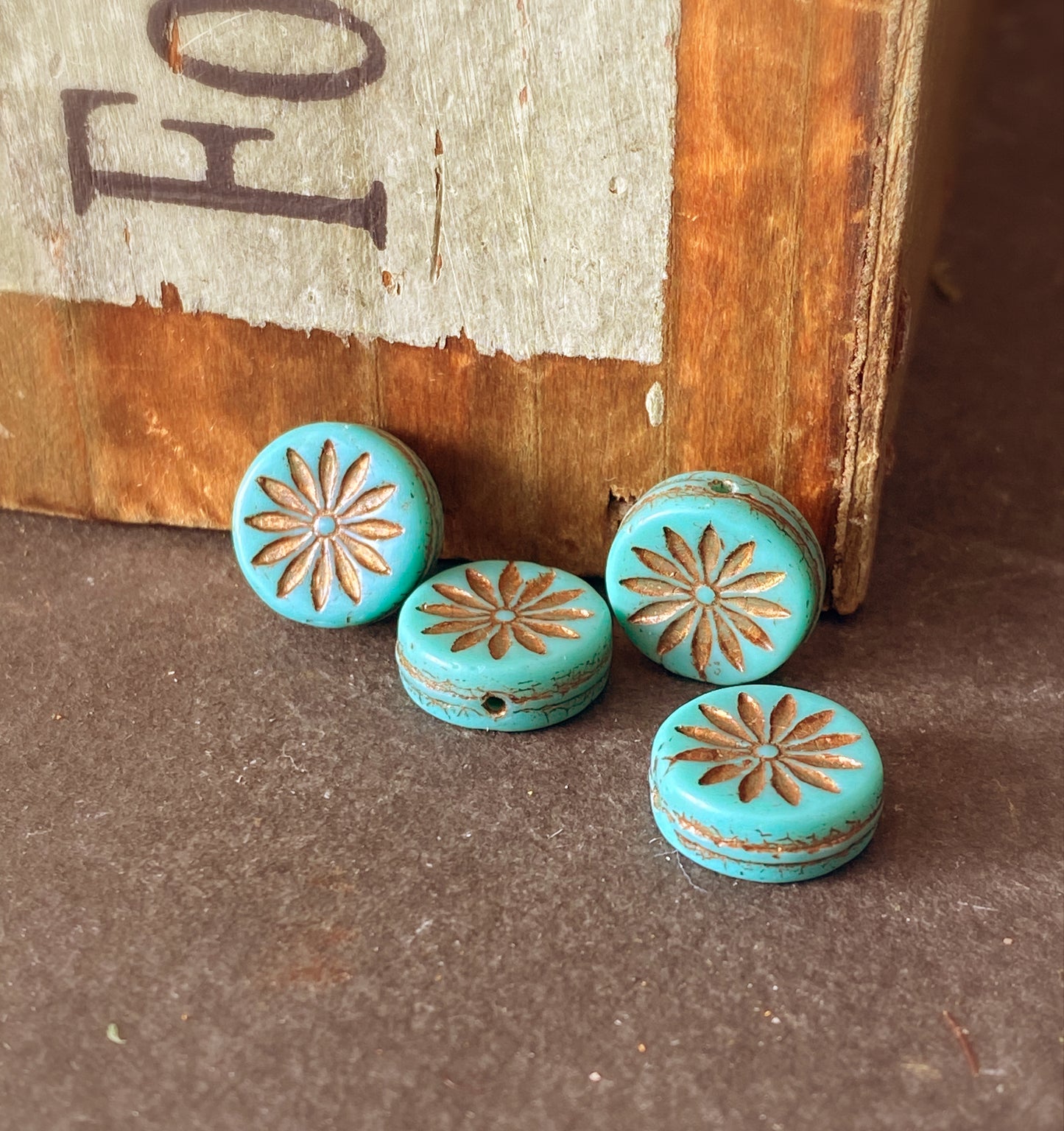 Czech glass, Coin with Aster (12mm) Turquoise Opaque with Dark Bronze Wash