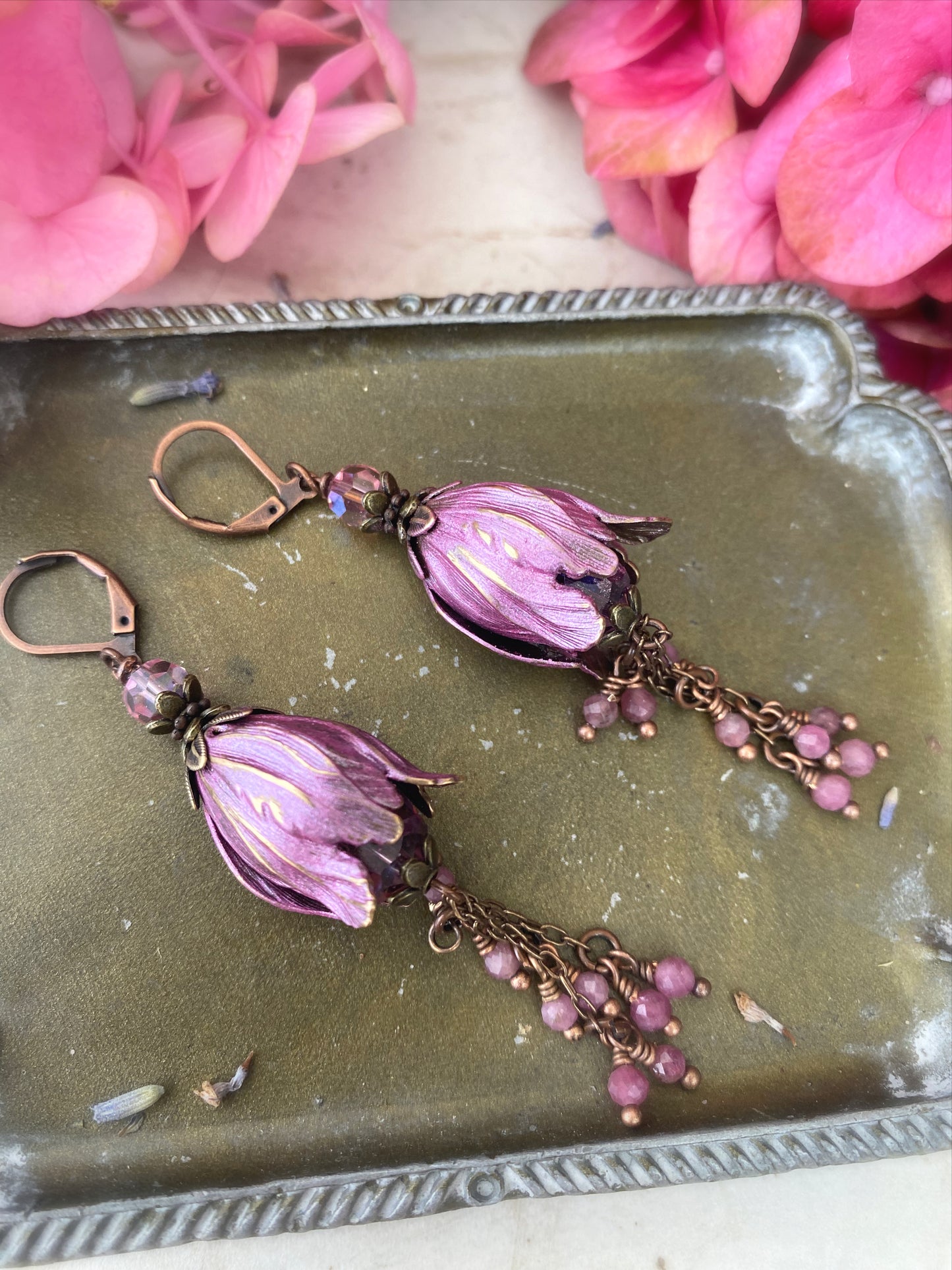 Pink crystal glass, pink tourmaline stone, flower bead caps, and copper metal earrings.