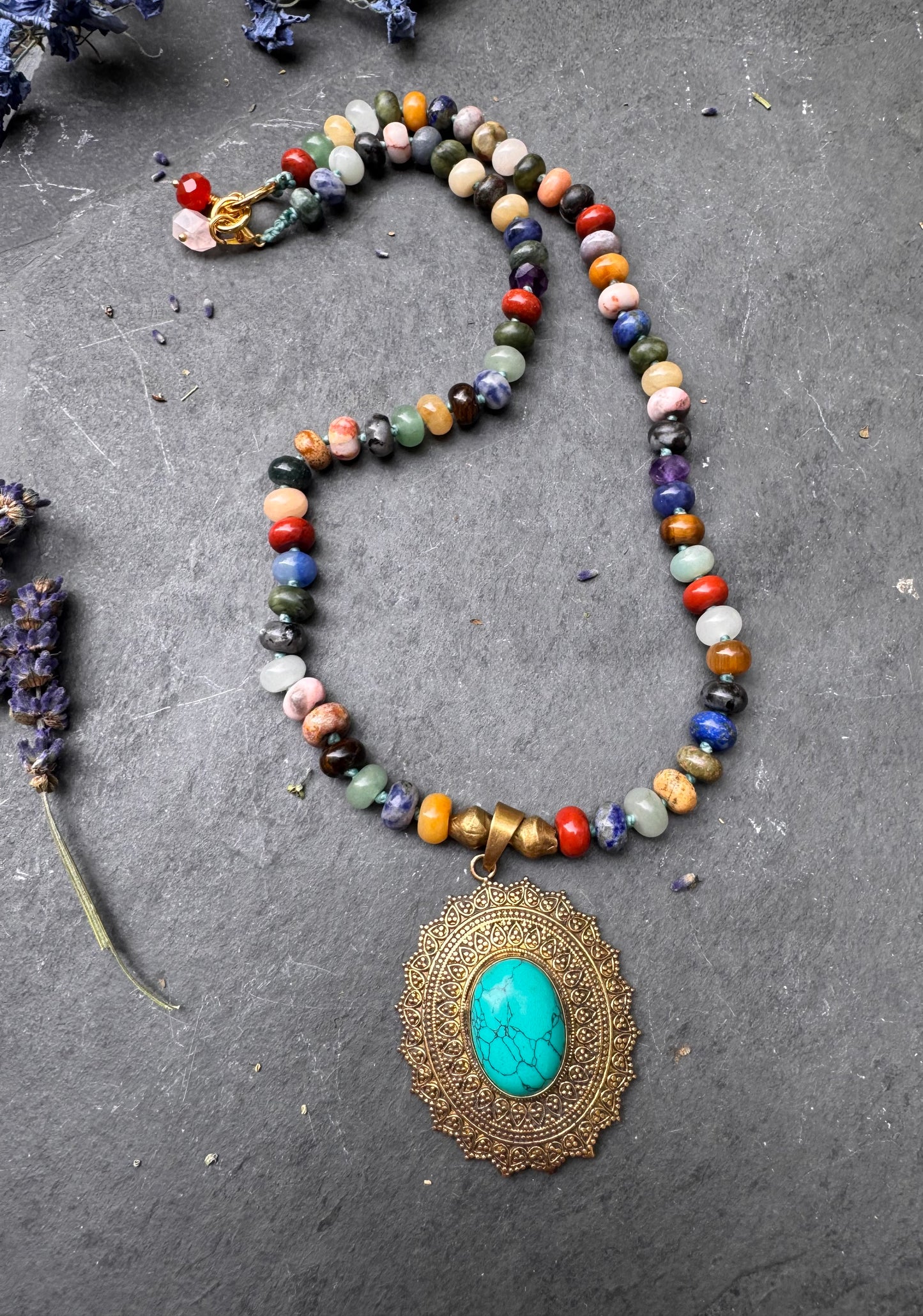 Mixed stone, knotted, brass metal and turquoise stone pendant, necklace