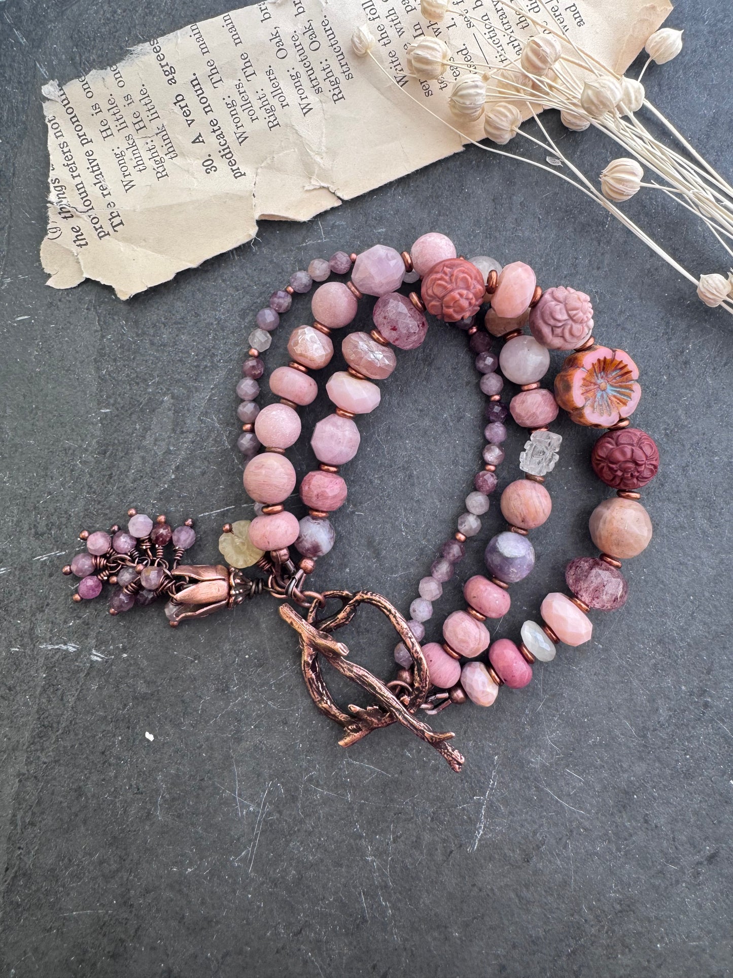 Mongolian agate carved flower, Ruby, Czech glass flower, rhodochrosite, strawberry quartz, moonstone, pink opal, purple mica, Lilac Lepidolite and copper clasp.