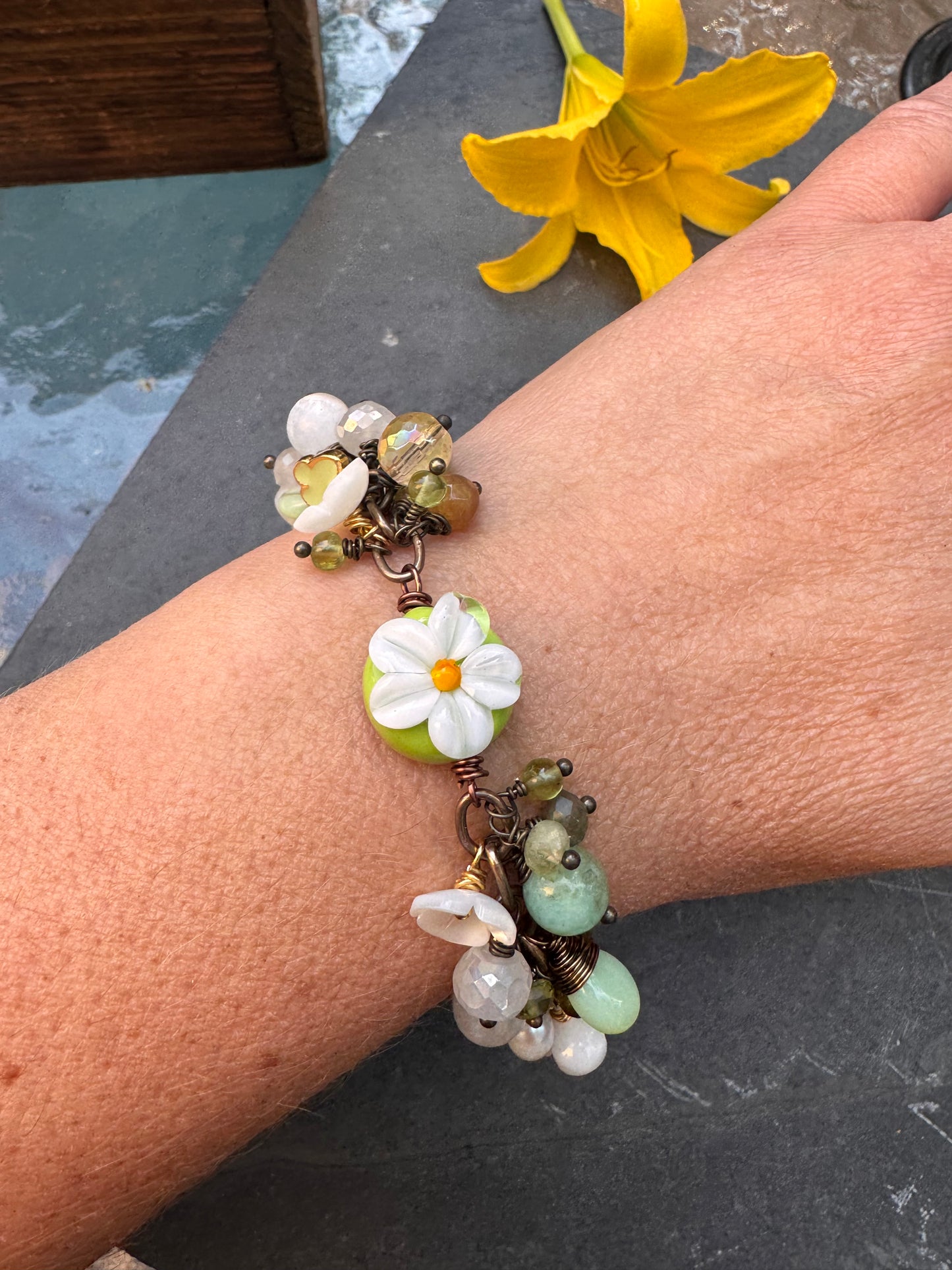 Daisy. Handmade lampwork glass, Mixed gemstone, pearls, bronze metal, charm bracelet.