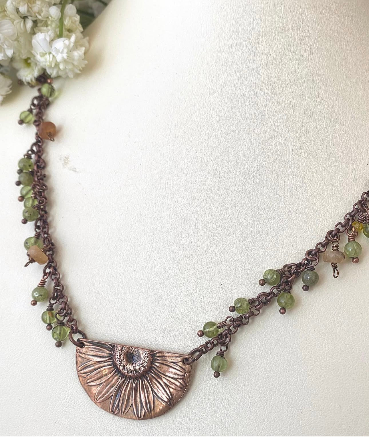 Sunflower pendant, peridot stone, copper metal, necklace