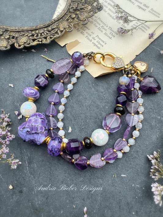 Purples. Mixed gemstone, lampwork glass, rhinestone clasp.