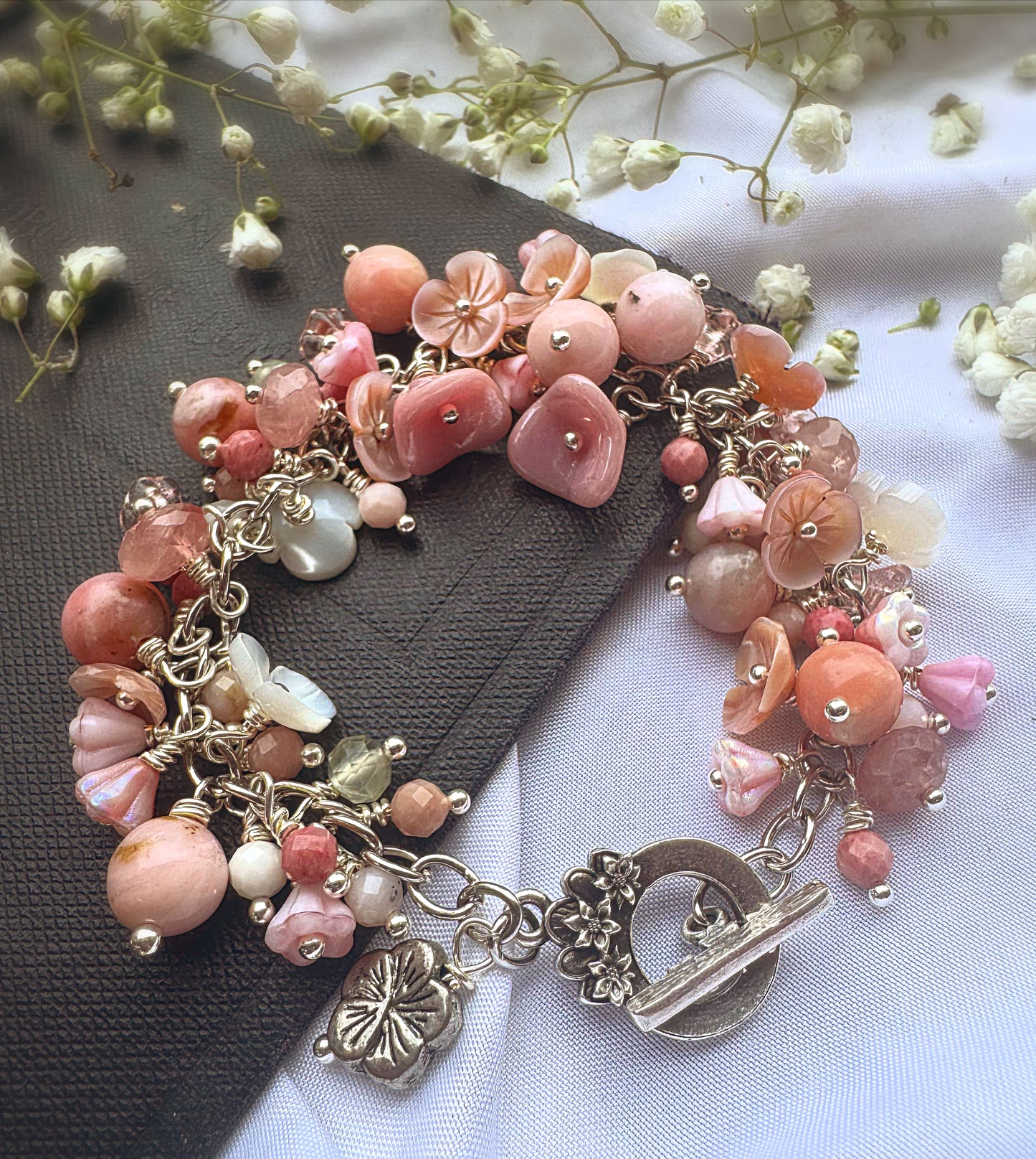 Pink opal, pink shell blossoms, rose quartz, peridot, sterling silver metal, blossom clasp, bracelet.