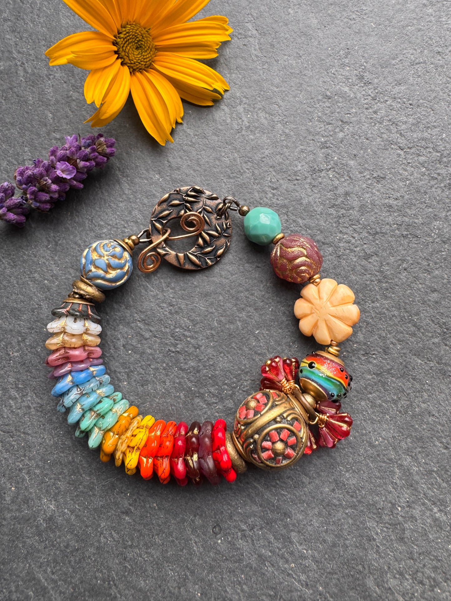 Rainbow flowers. Nepal coral flower bead, Mixed Czech glass flowers, lampwork glass, leaf bronze toggle clasp.