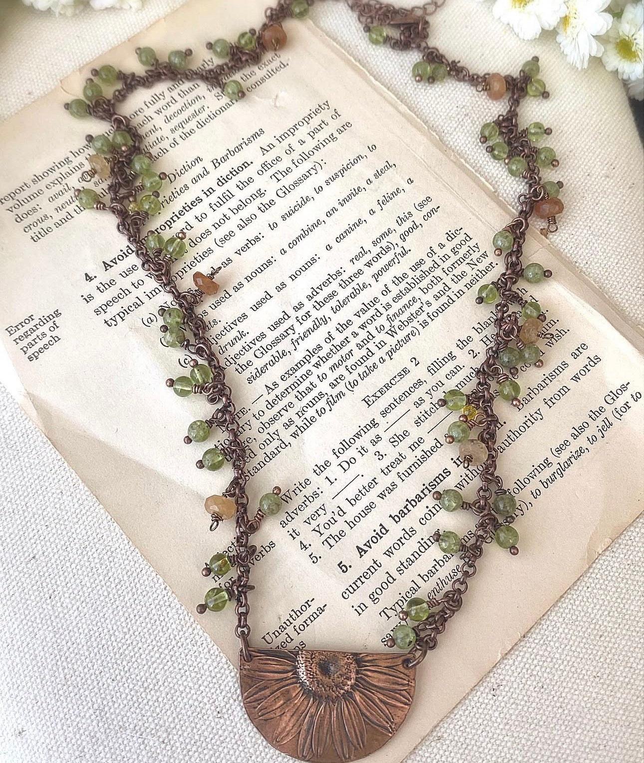 Sunflower pendant, peridot stone, copper metal, necklace