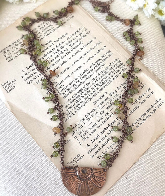 Sunflower pendant, peridot stone, copper metal, necklace