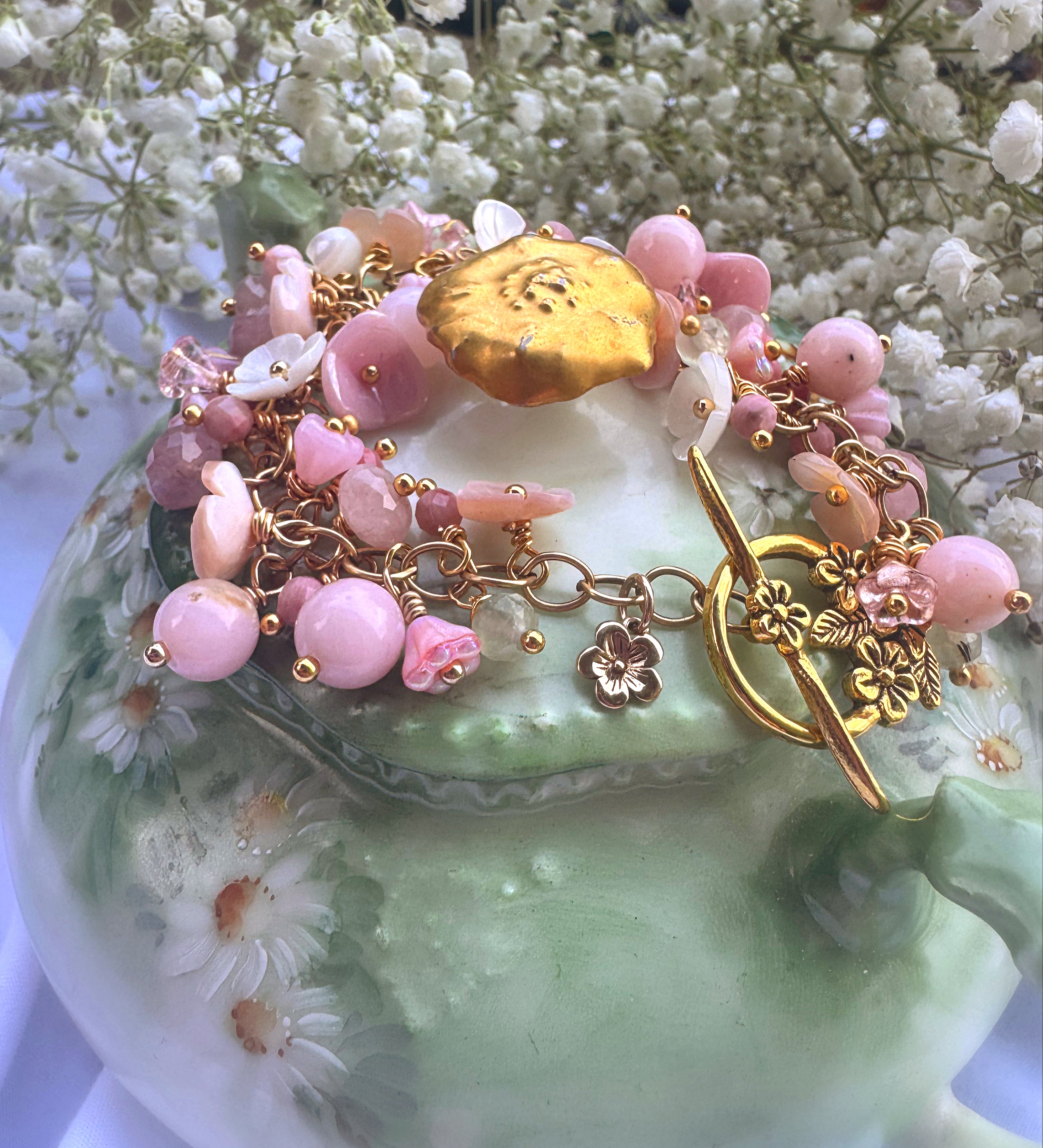 Pink opal, pink shell blossoms, rose quartz, peridot, gold metal