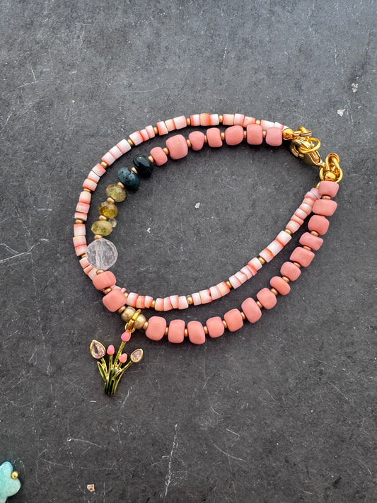 Pink shell, Java glass, quartz, peridot stone, gold metal bracelet.
