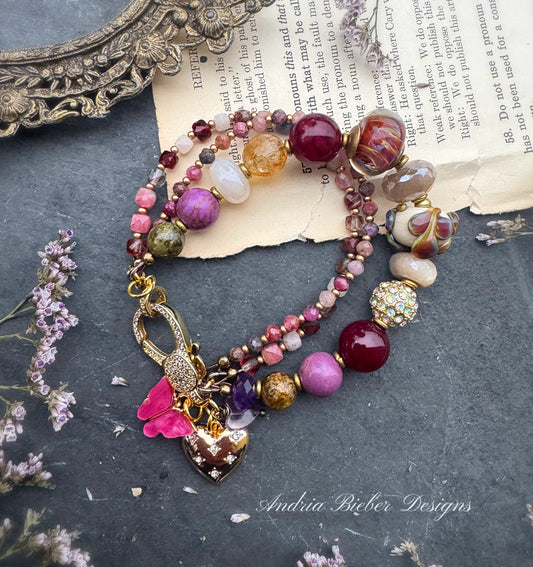 Ruby. Mixed gemstone, lampwork glass, rhinestone clasp.